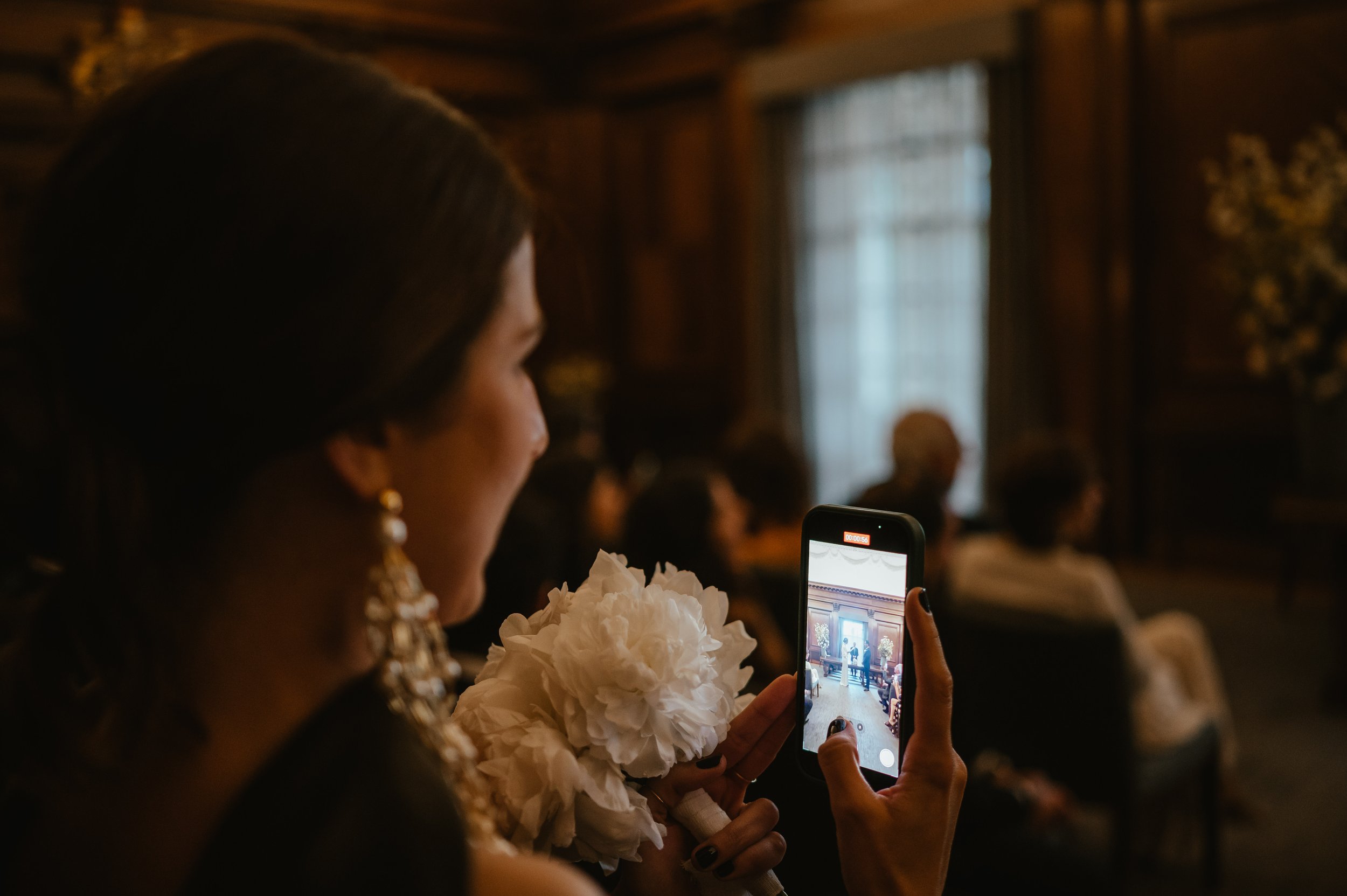 guest recording wedding at civil ceremony