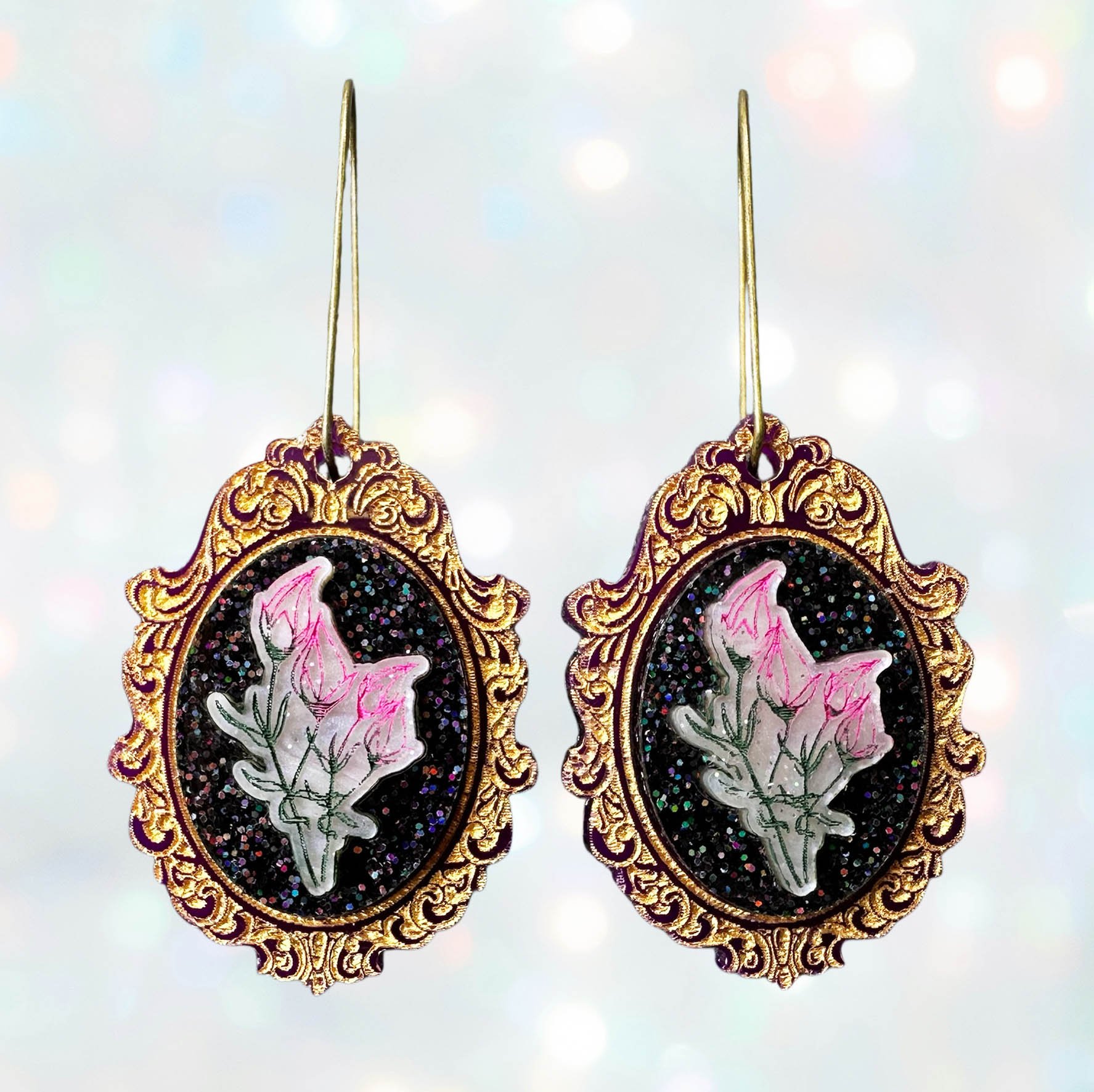 Laser cut flower earrings in cameo style frames, gold, pink and black glitter acrylic