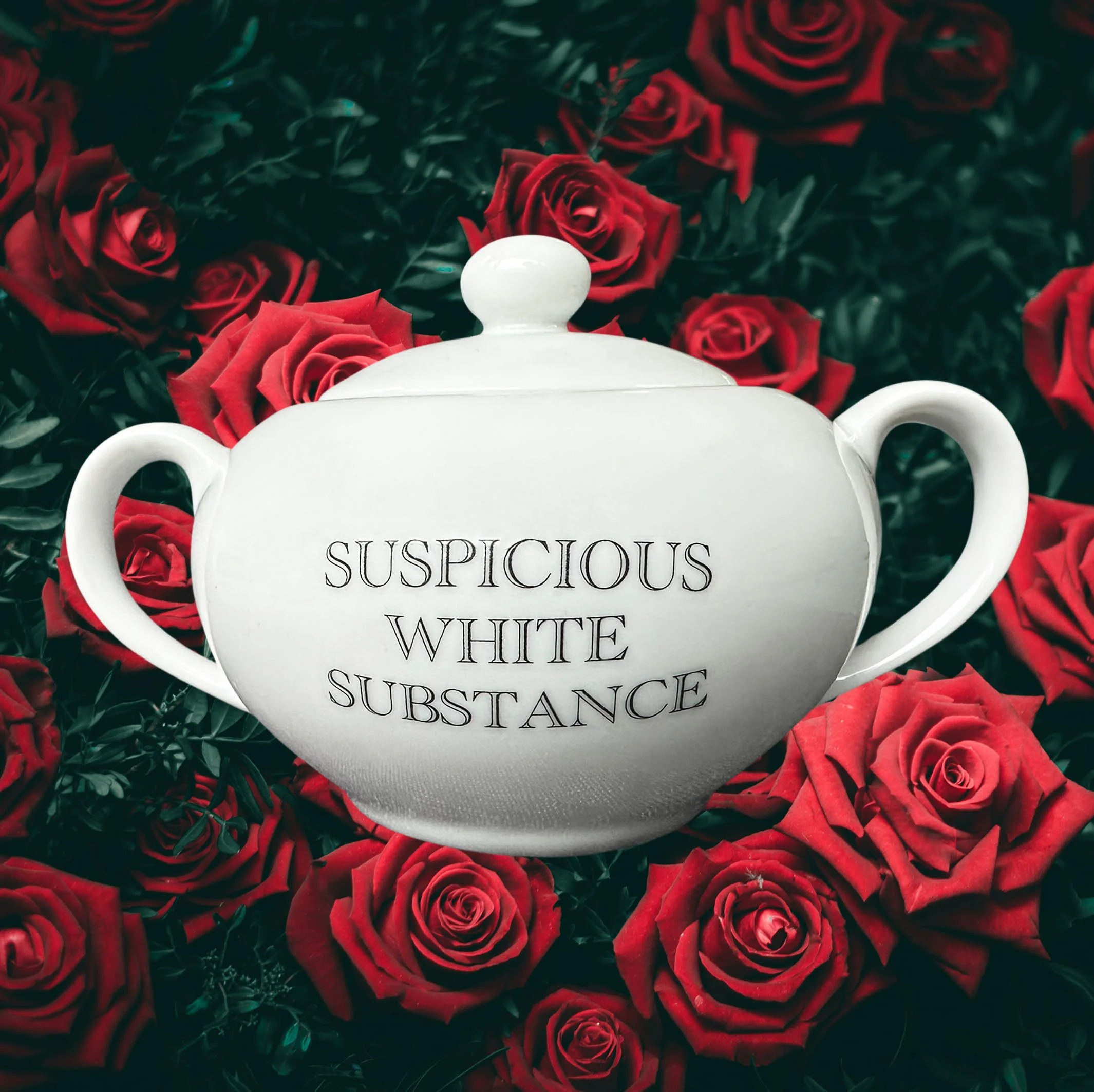 A white sugar bowl with handles and the words “suspicious white substance” in black lettering