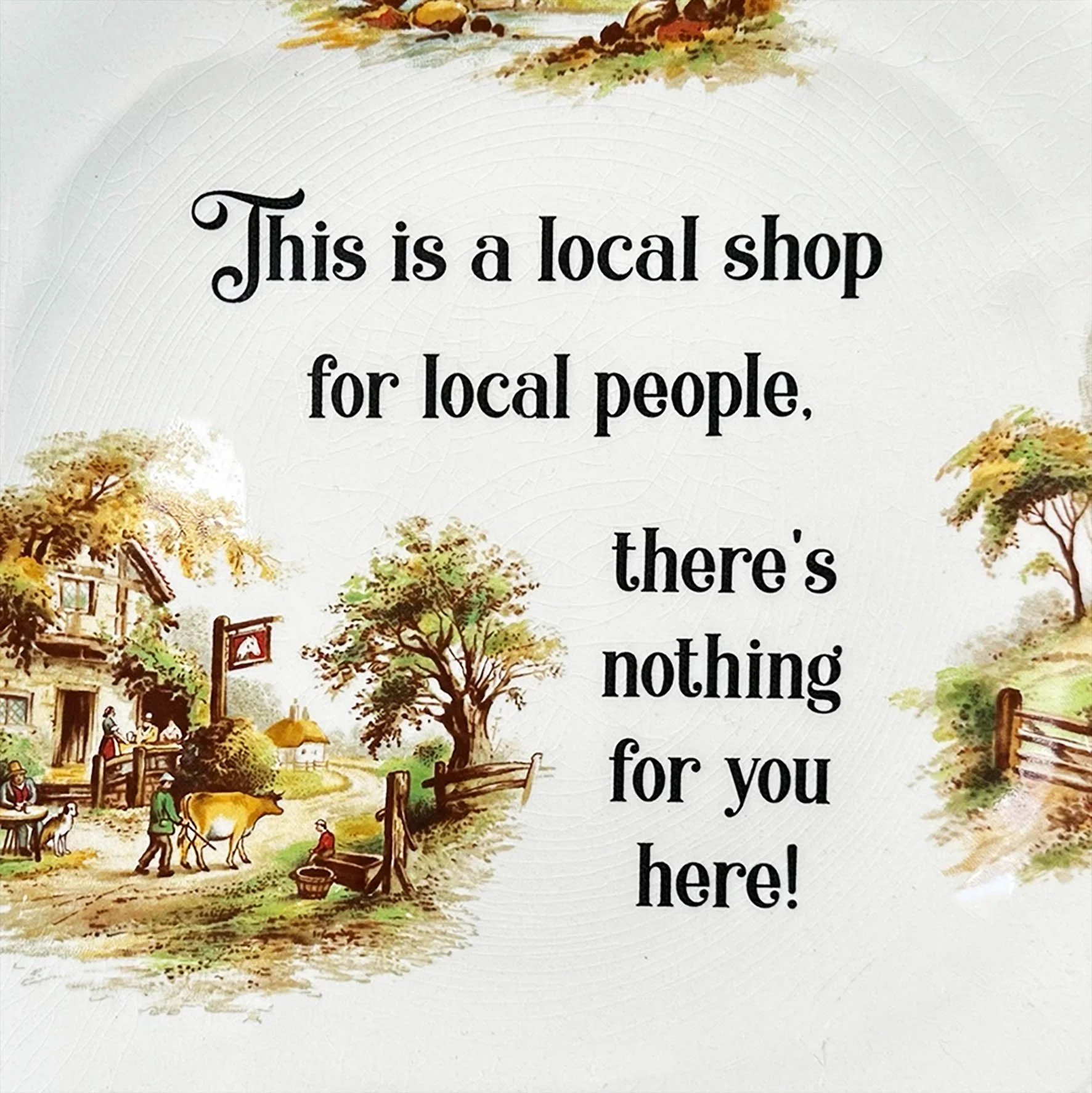 A vintage wall plate with a quote from The League Of Gentlemen "this is a local shop for local people, there's nothing for you here!"