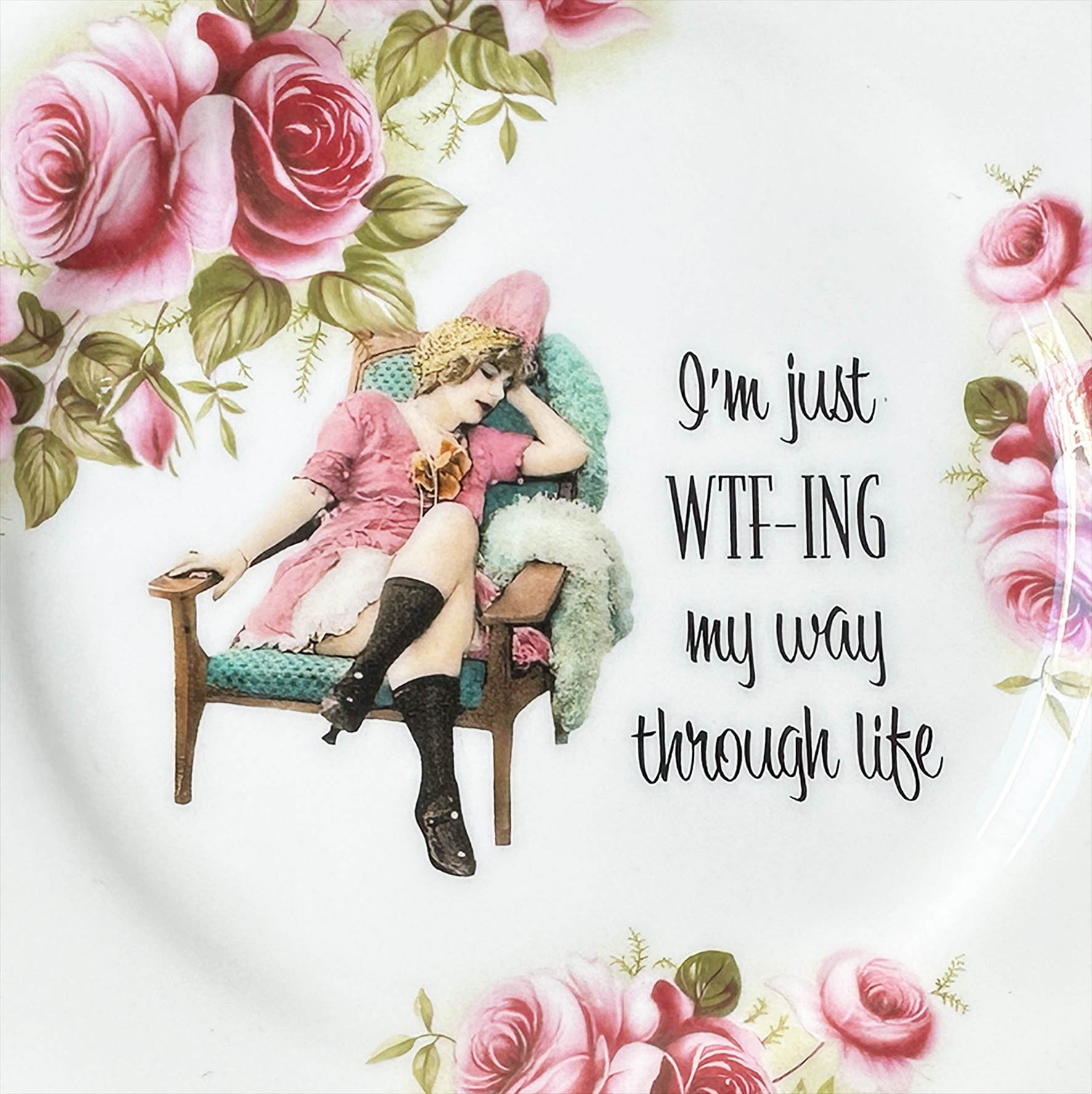 Plate A, small plate with flowers and the quote “I’m just WTF-ING my way through life”