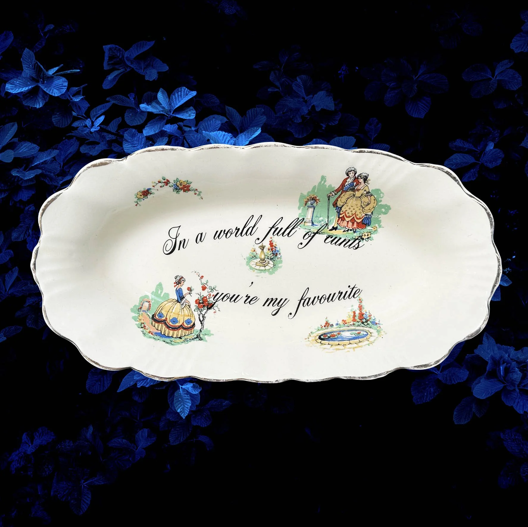 A vintage trinket dish with the quote “In a world full of cunts you’re my favourite”