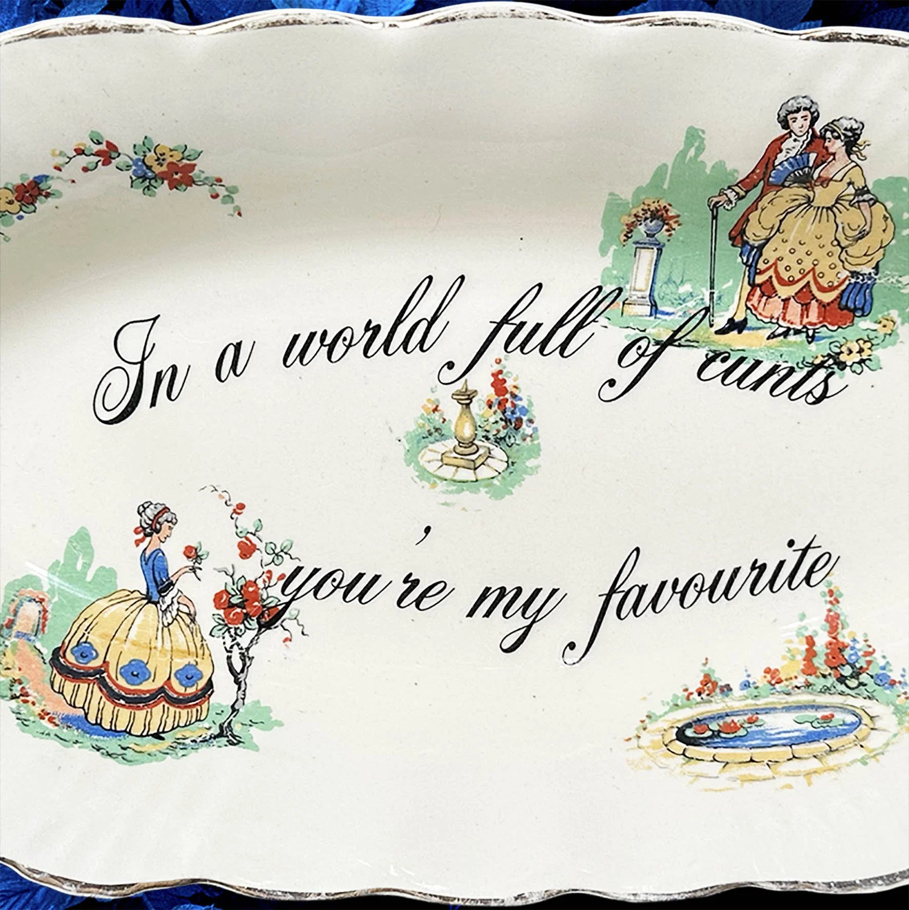 A vintage trinket dish with the quote “In a world full of cunts you’re my favourite”