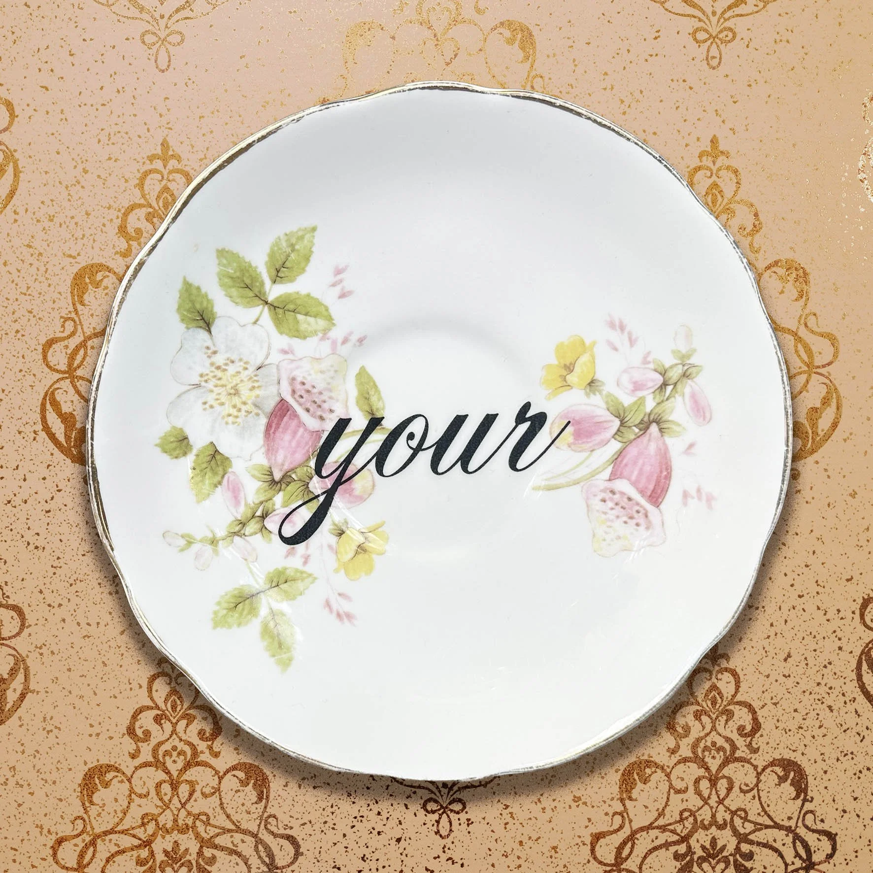 A saucer with the word “your”
