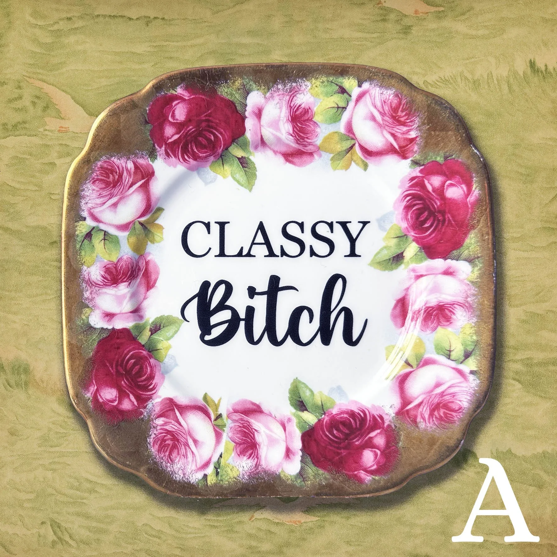 A vintage Royal Albert rose plate with a quote “classy bitch” with black lettering