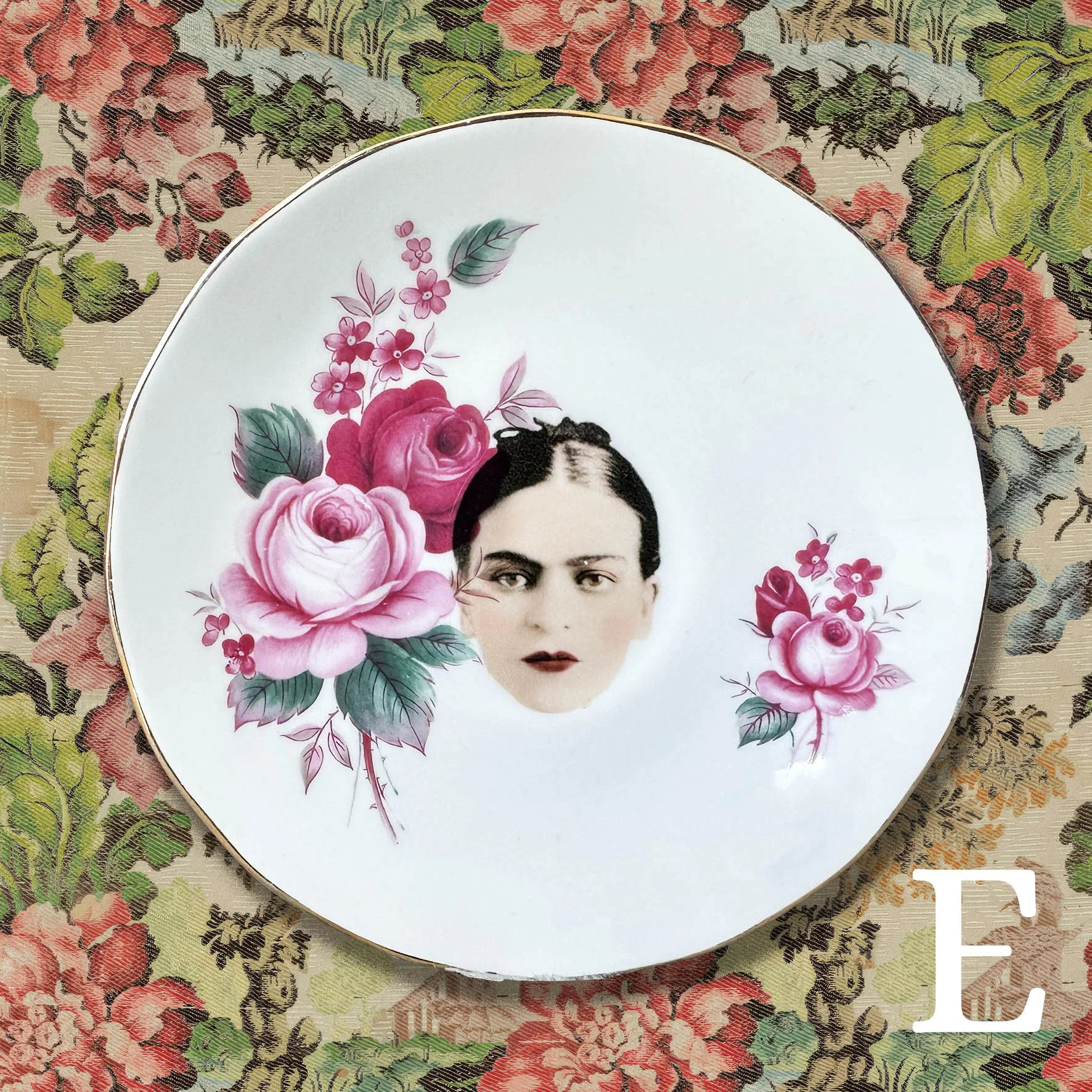 A vintage saucer with a picture of a woman