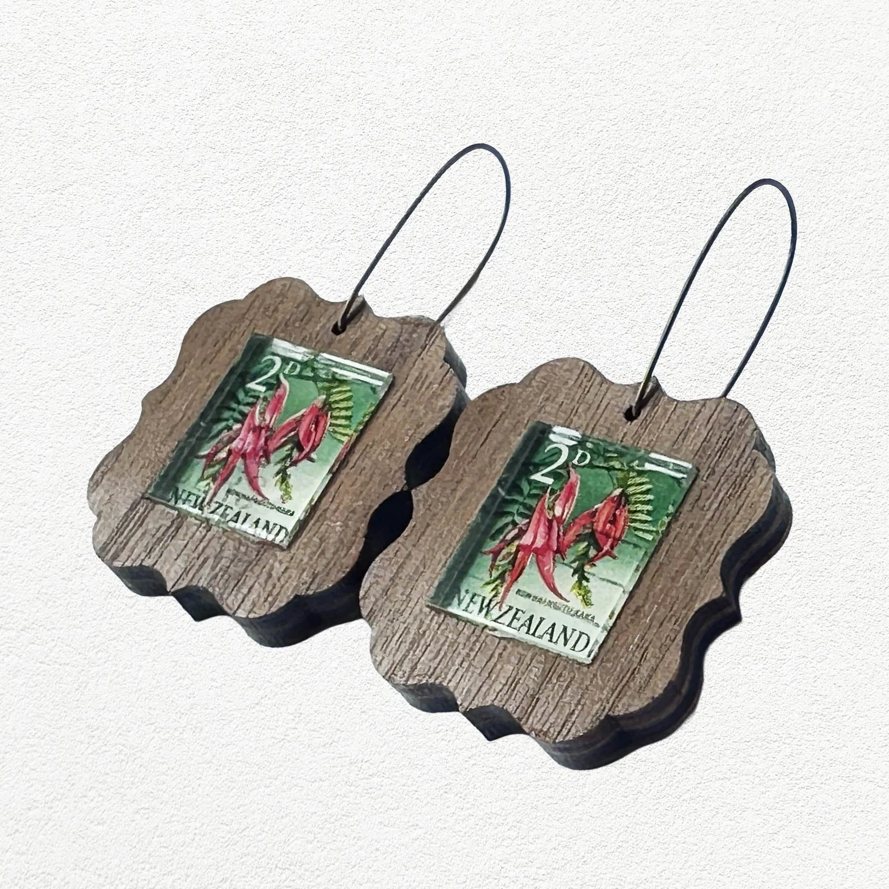 Wooden earrings featuring vintage New Zealand Kakabeak postage stamps.