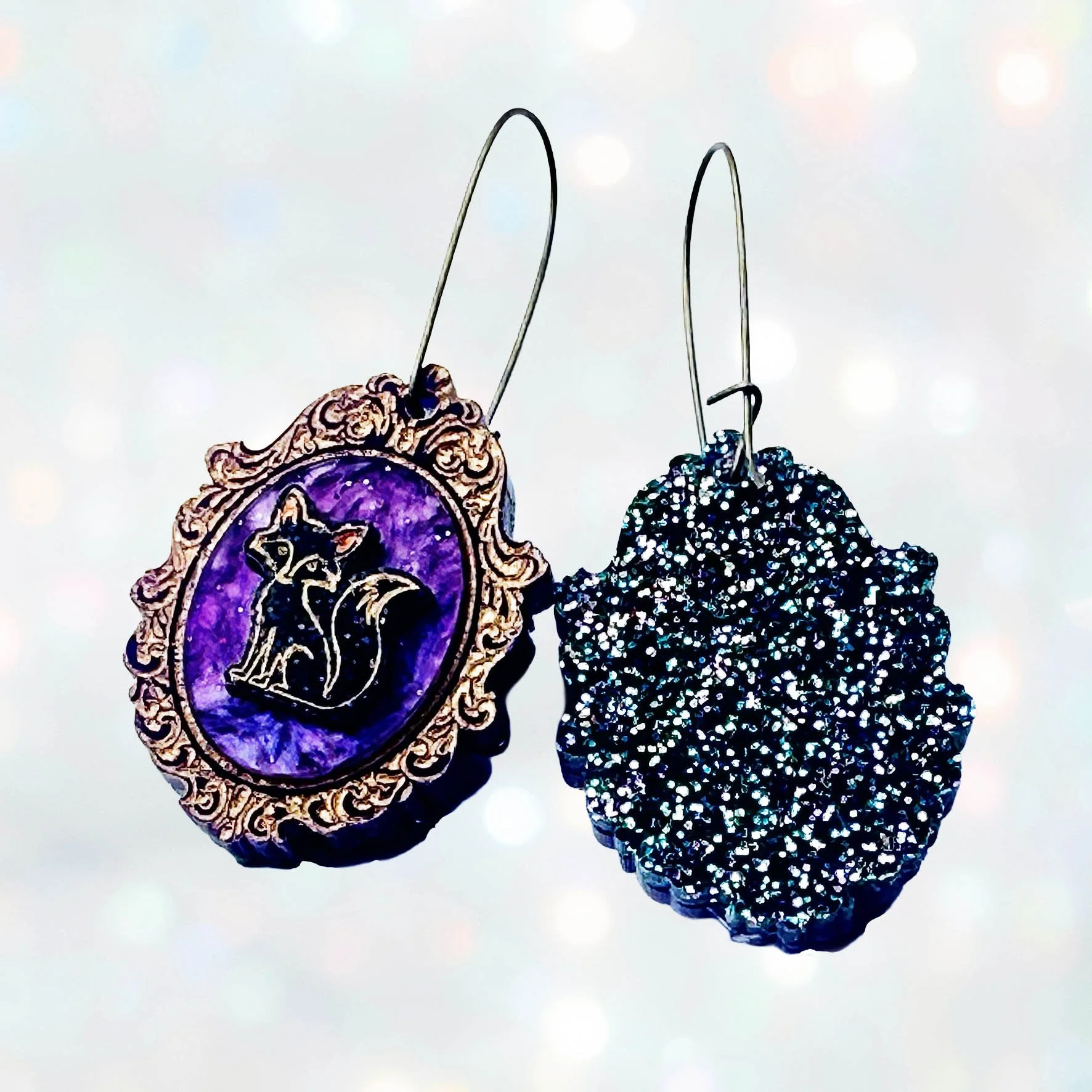 Laser cut glitter acrylic earrings featuring foxes inside gold frames