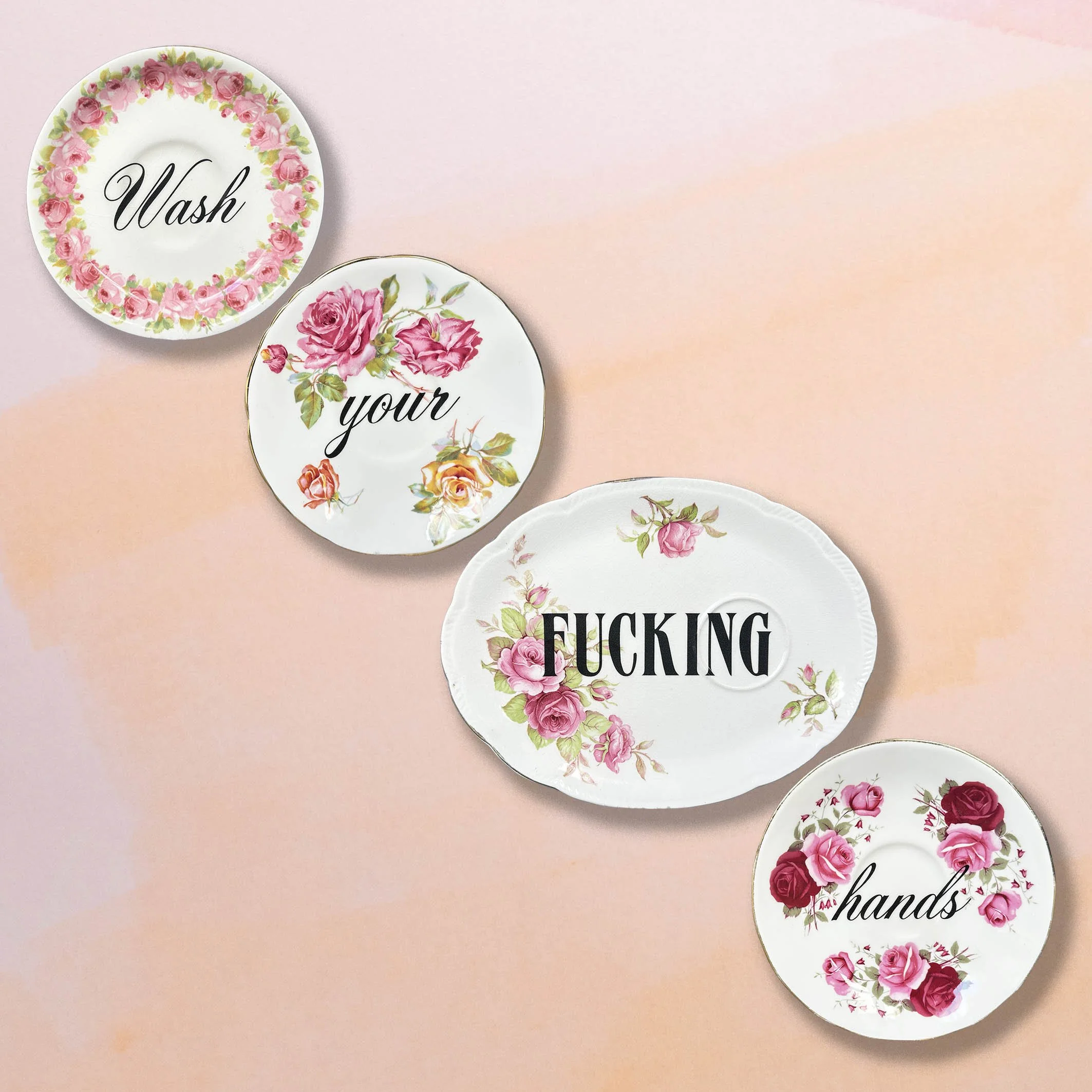 A plate set with the cheeky quote "wash your fucking hands"