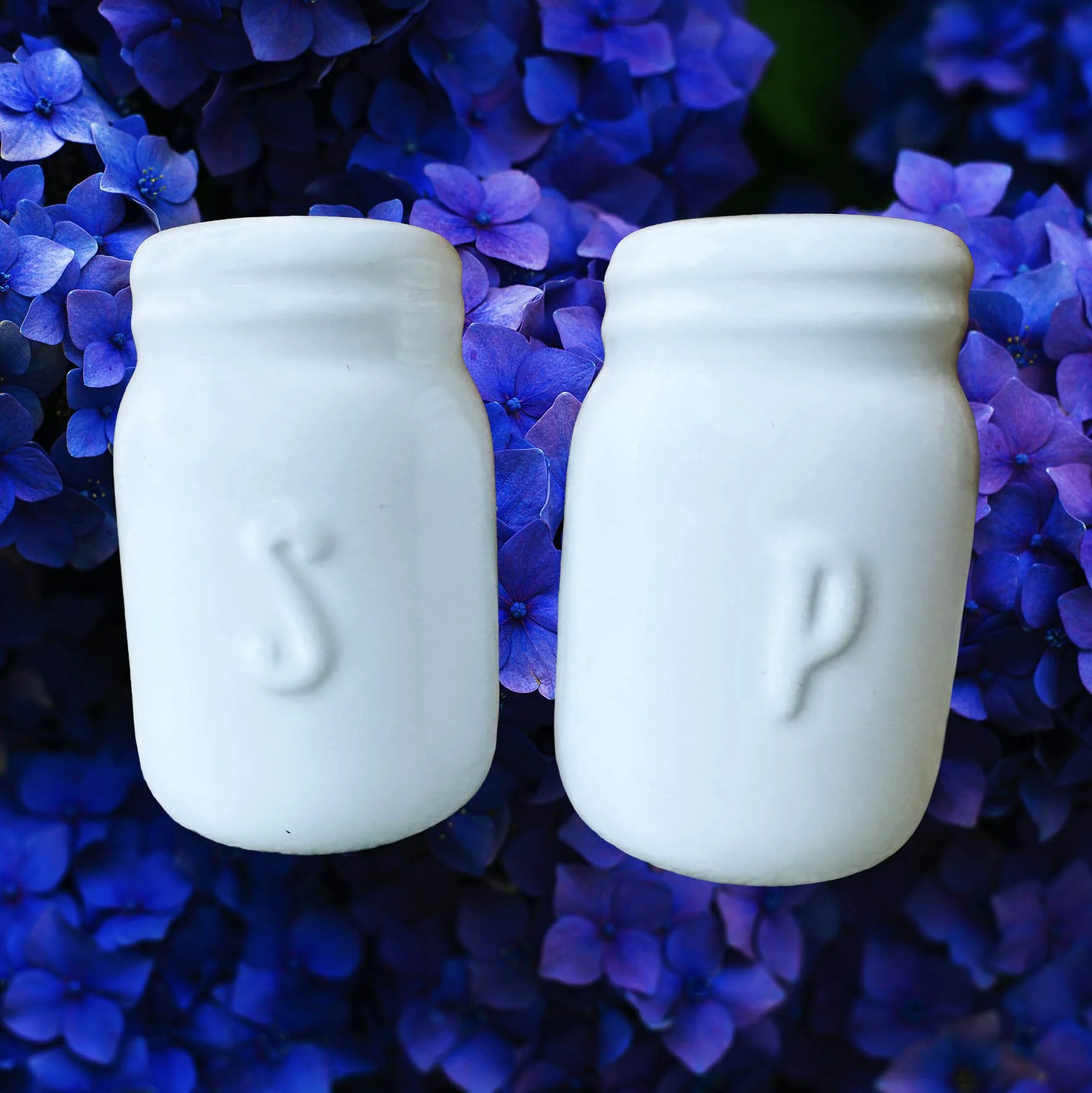 White salt and pepper shakers with the words “salty” and “as fuck” in black lettering