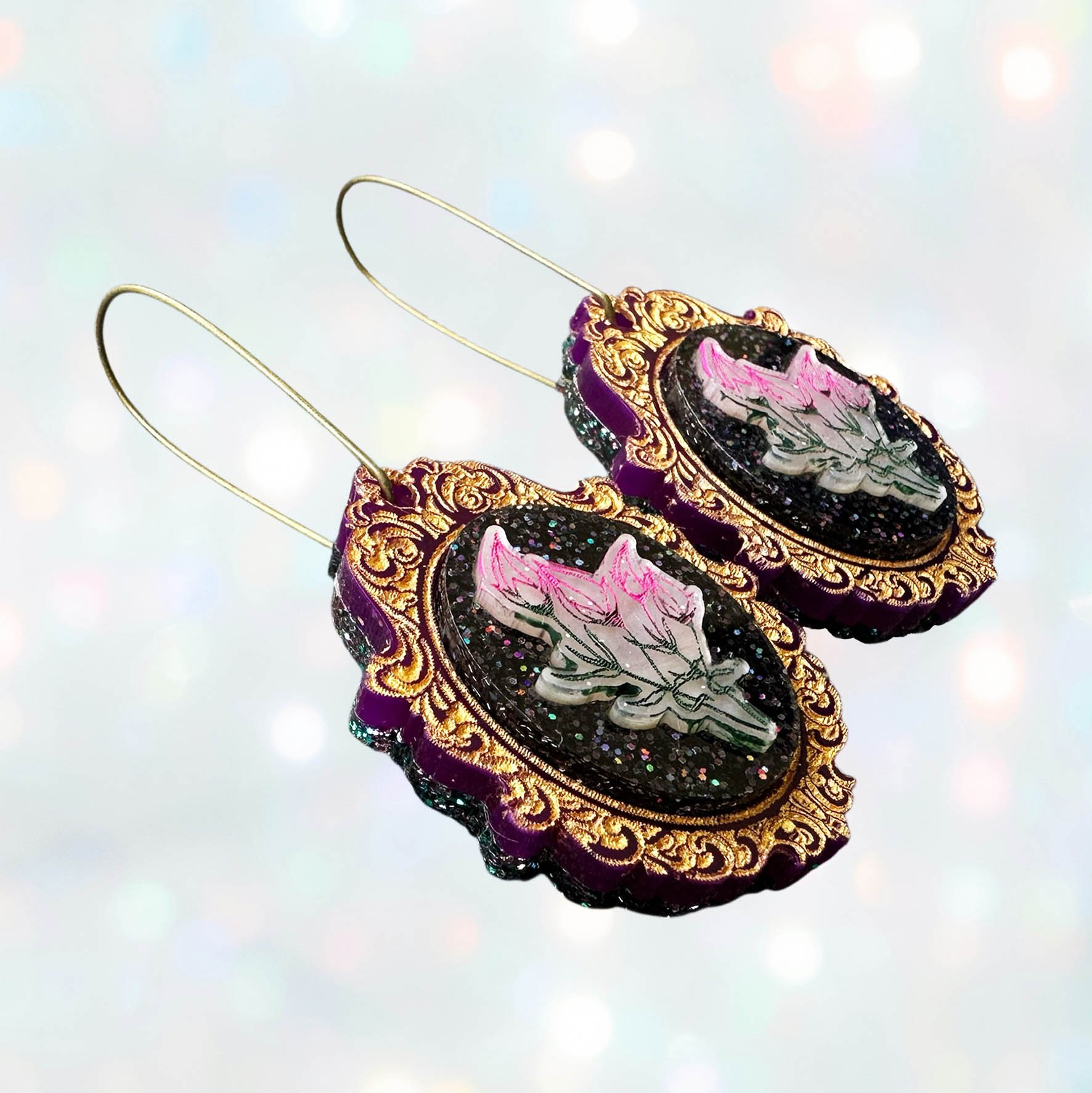 Laser cut flower earrings in cameo style frames, gold, pink and black glitter acrylic
