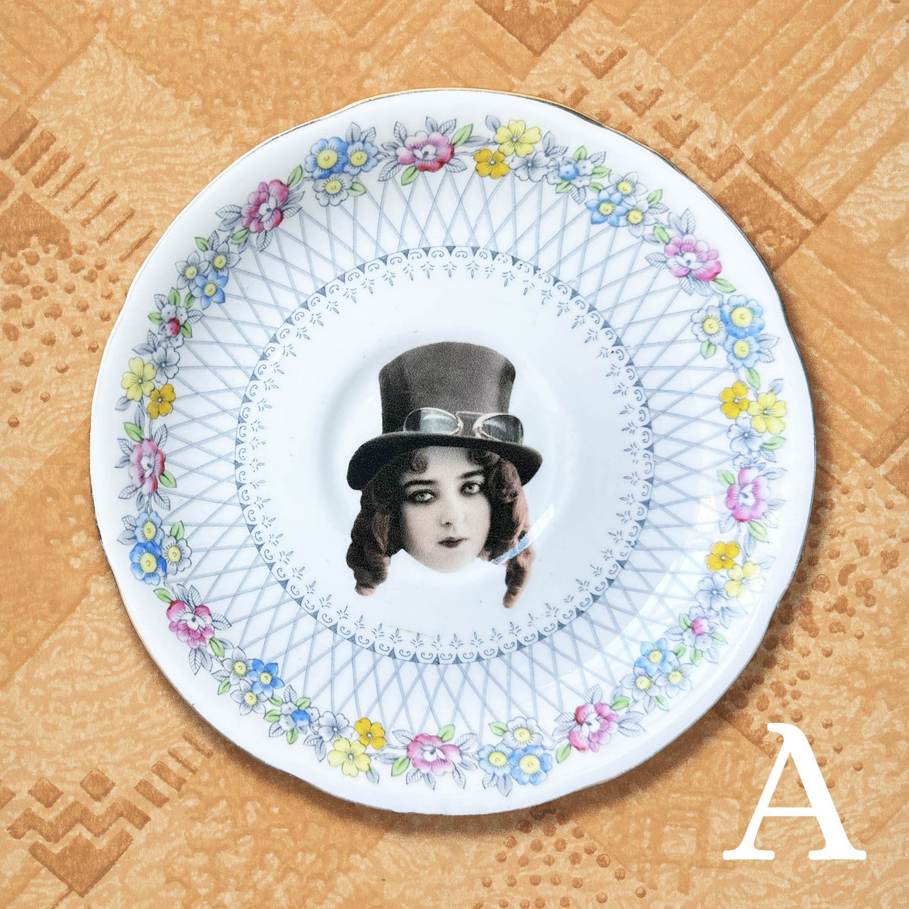 A vintage saucer with a picture of a steampunk woman