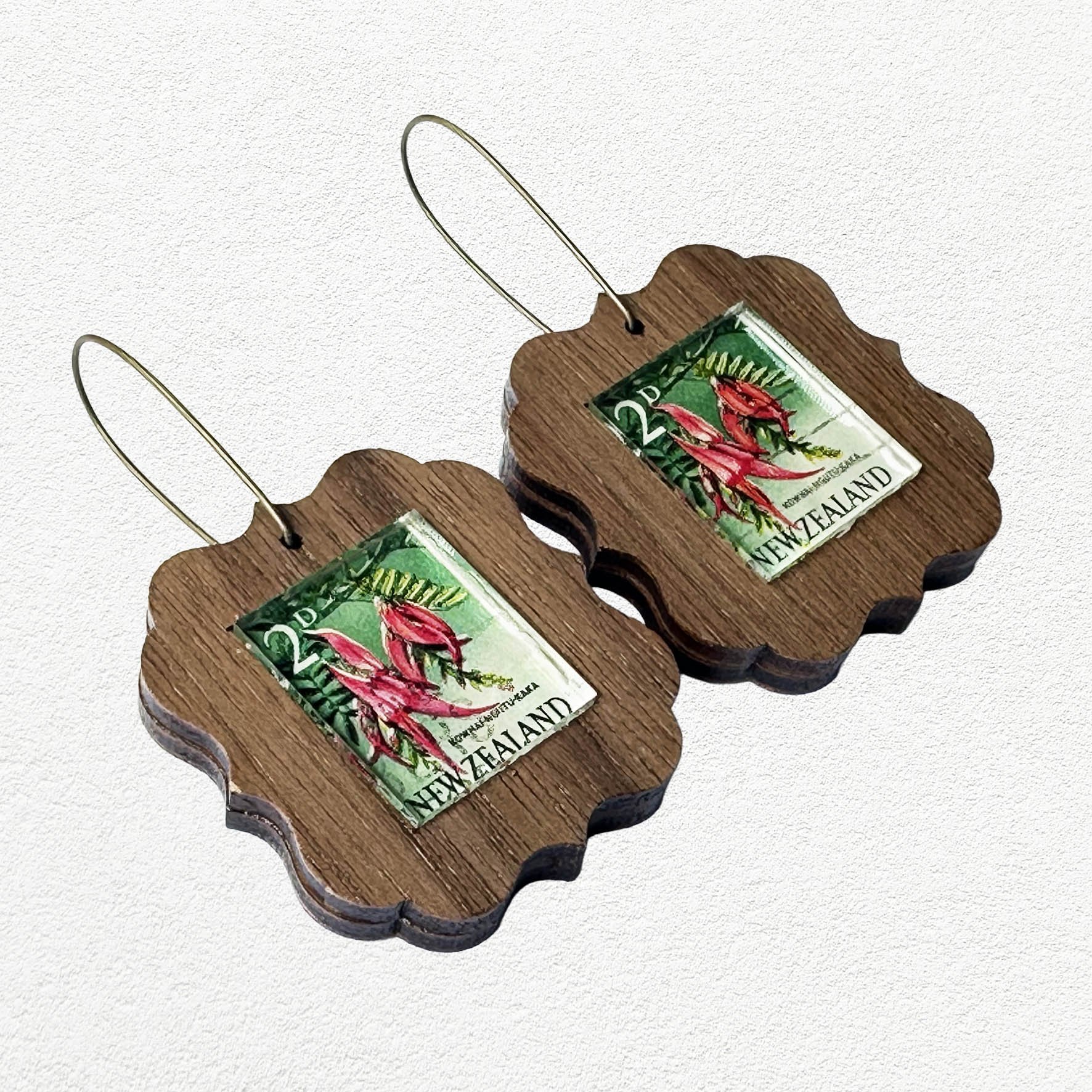 Wooden earrings featuring vintage New Zealand Kakabeak postage stamps.
