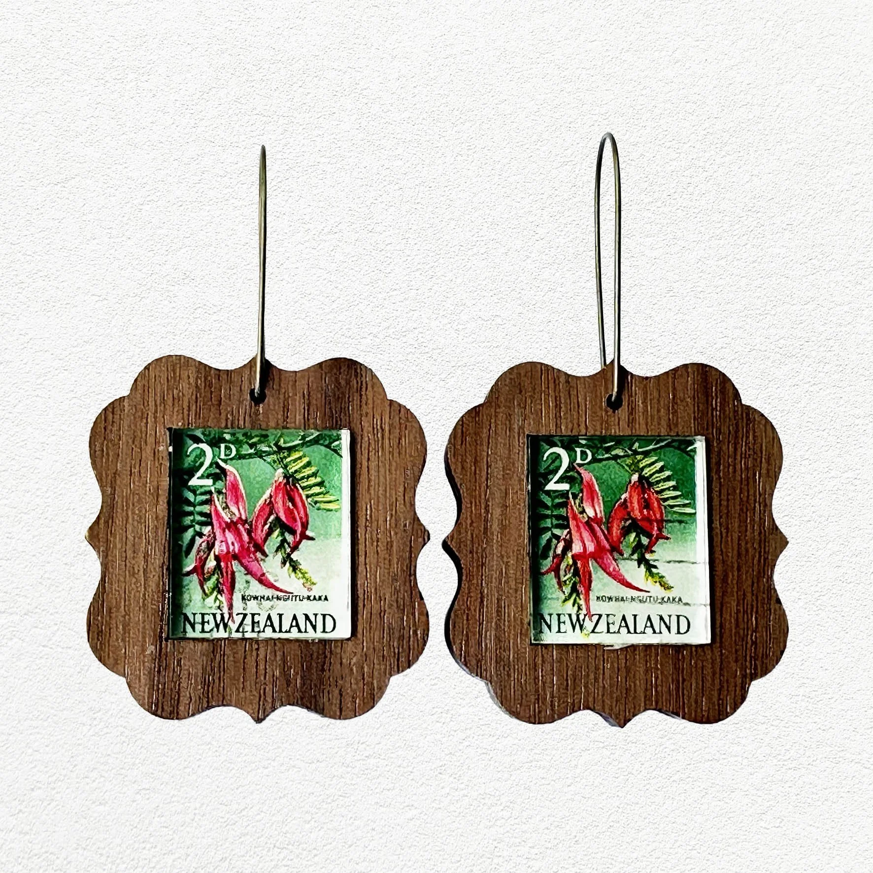 Wooden earrings featuring vintage New Zealand Kakabeak postage stamps.
