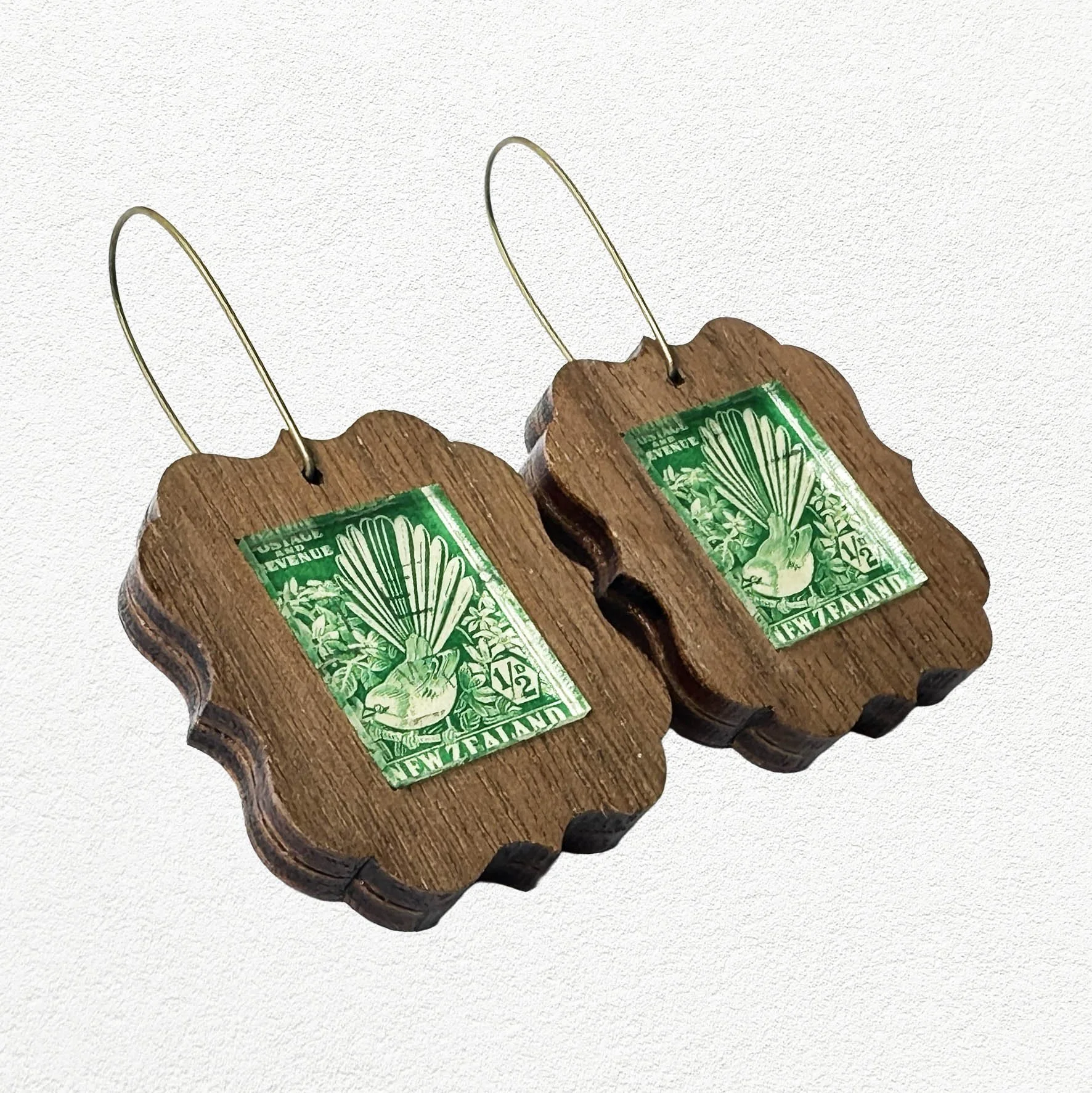 Wooden earings featuring vintage New Zealand Fantail postage stamps.