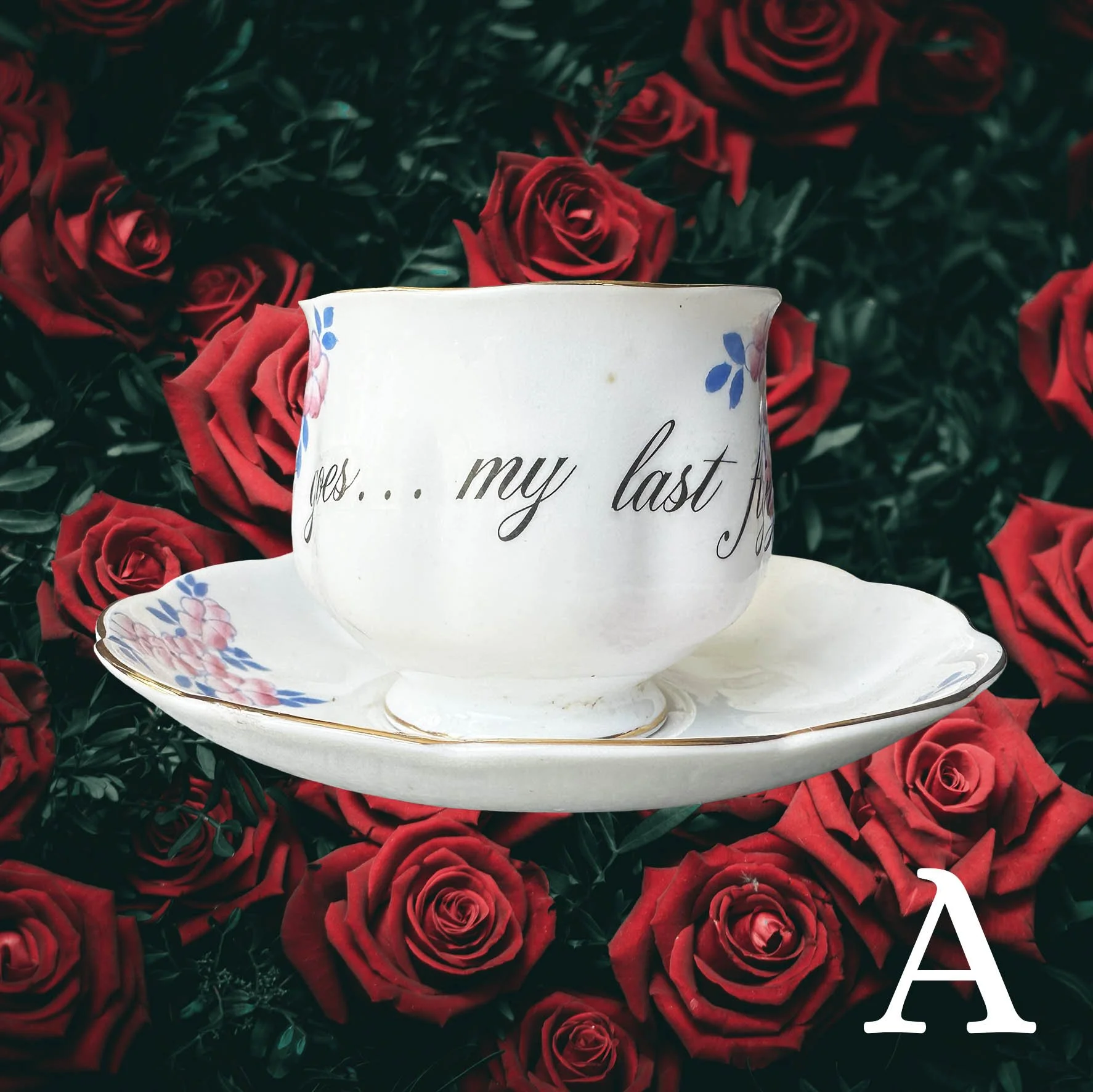 A vintage tea cup with a blue and pink floral design and the words "there it goes...my last flying fuck!"