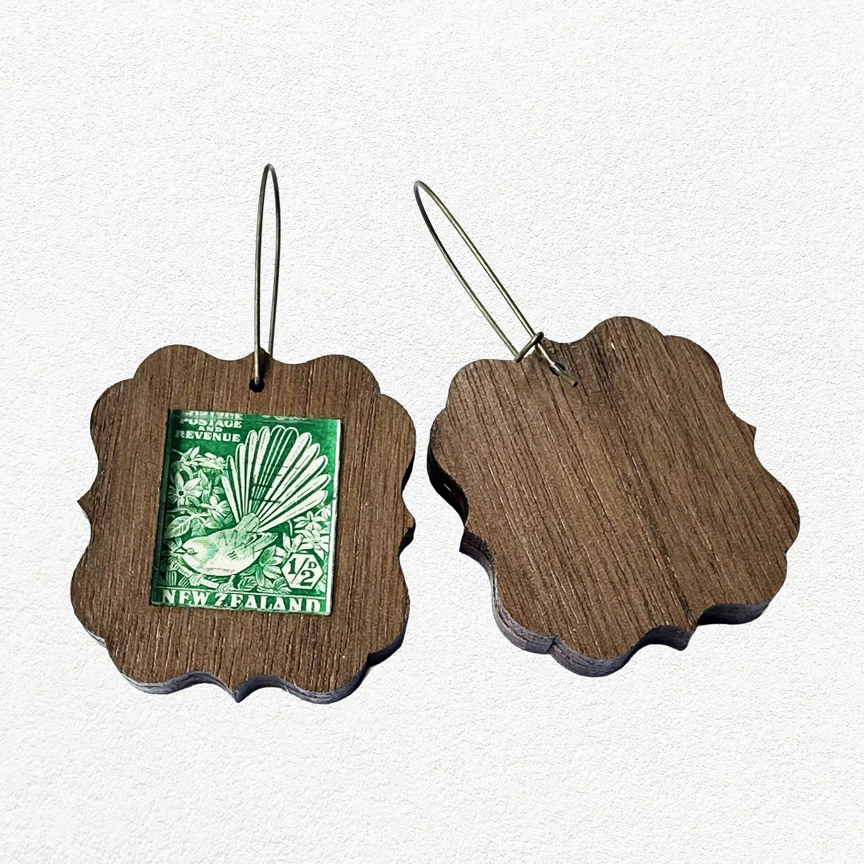 Wooden earings featuring vintage New Zealand Fantail postage stamps.