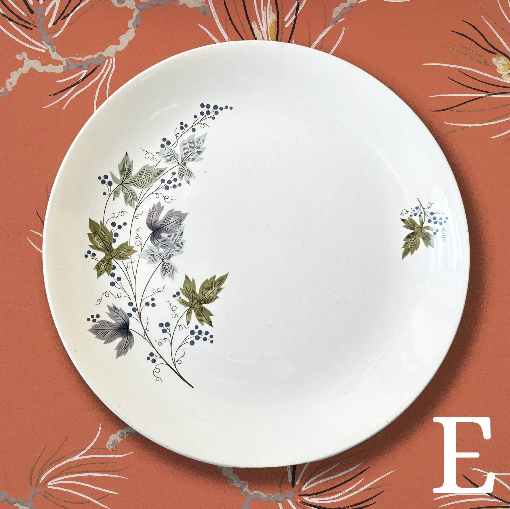 Large Plate E, Crown Lynn plate with blue and green leaves