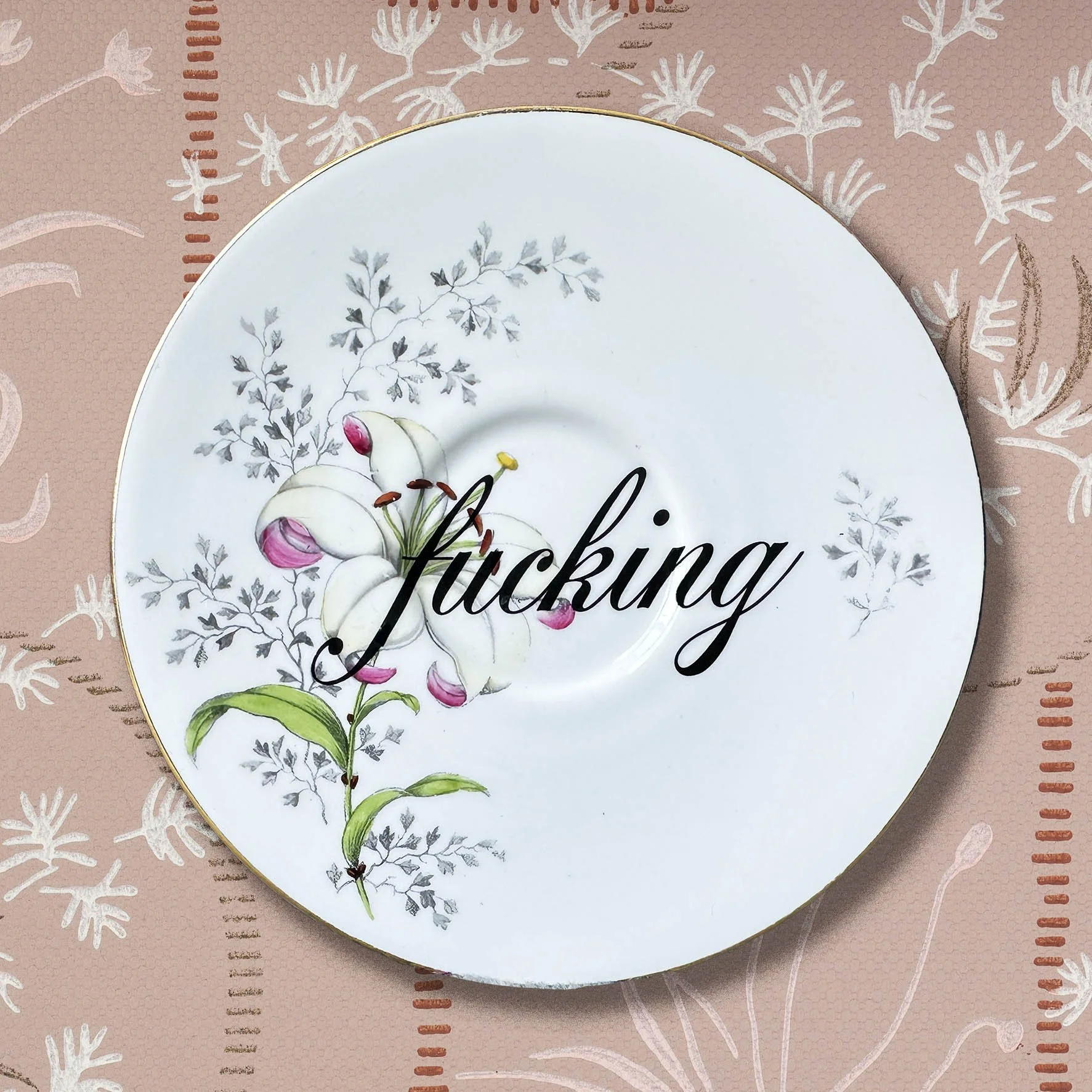 Vintage saucer with the word “fucking”