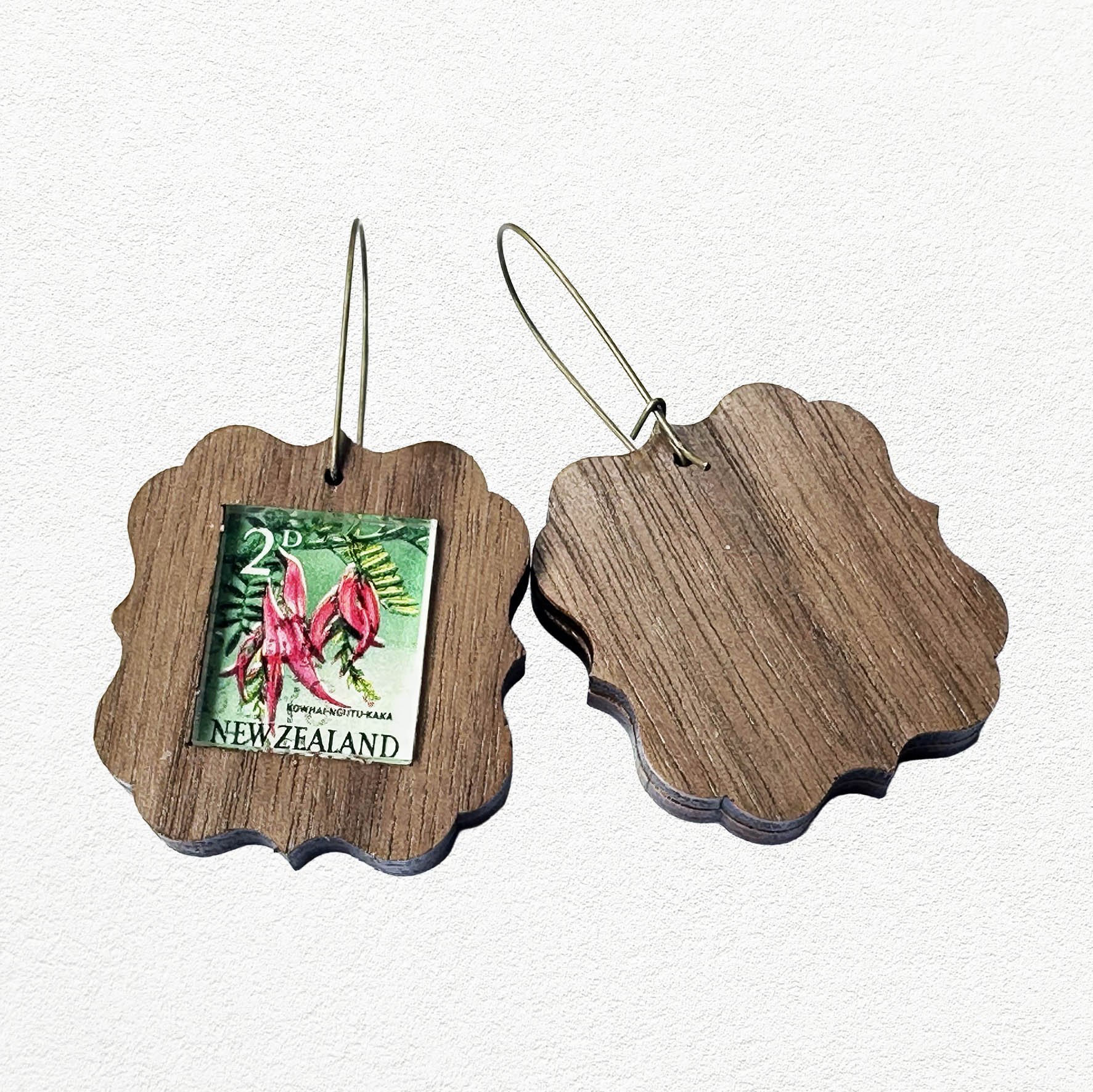 Wooden earrings featuring vintage New Zealand Kakabeak postage stamps.