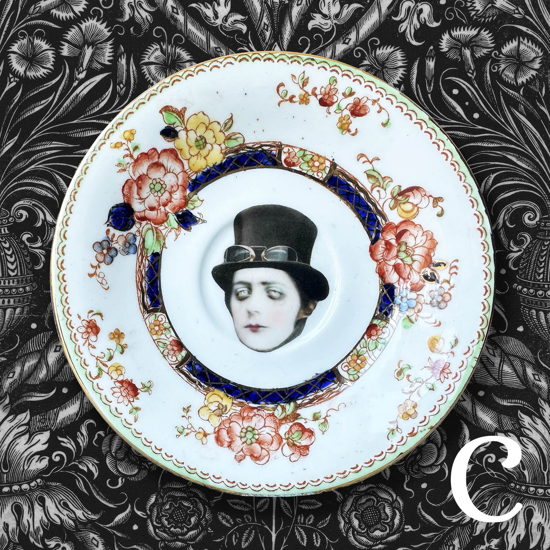 A vintage saucer with a picture of a steampunk man