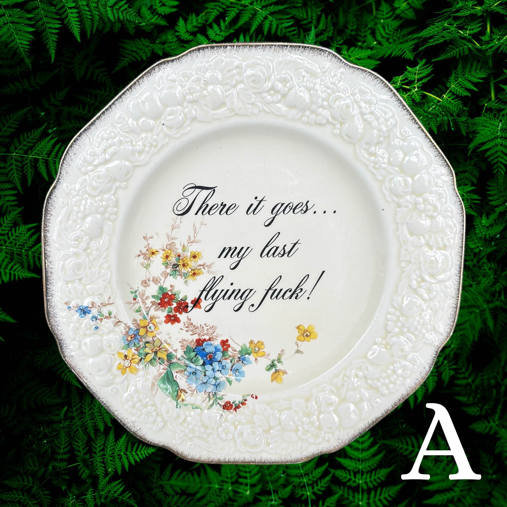 a decorative plate with the words "There it goes...my last flying fuck!"