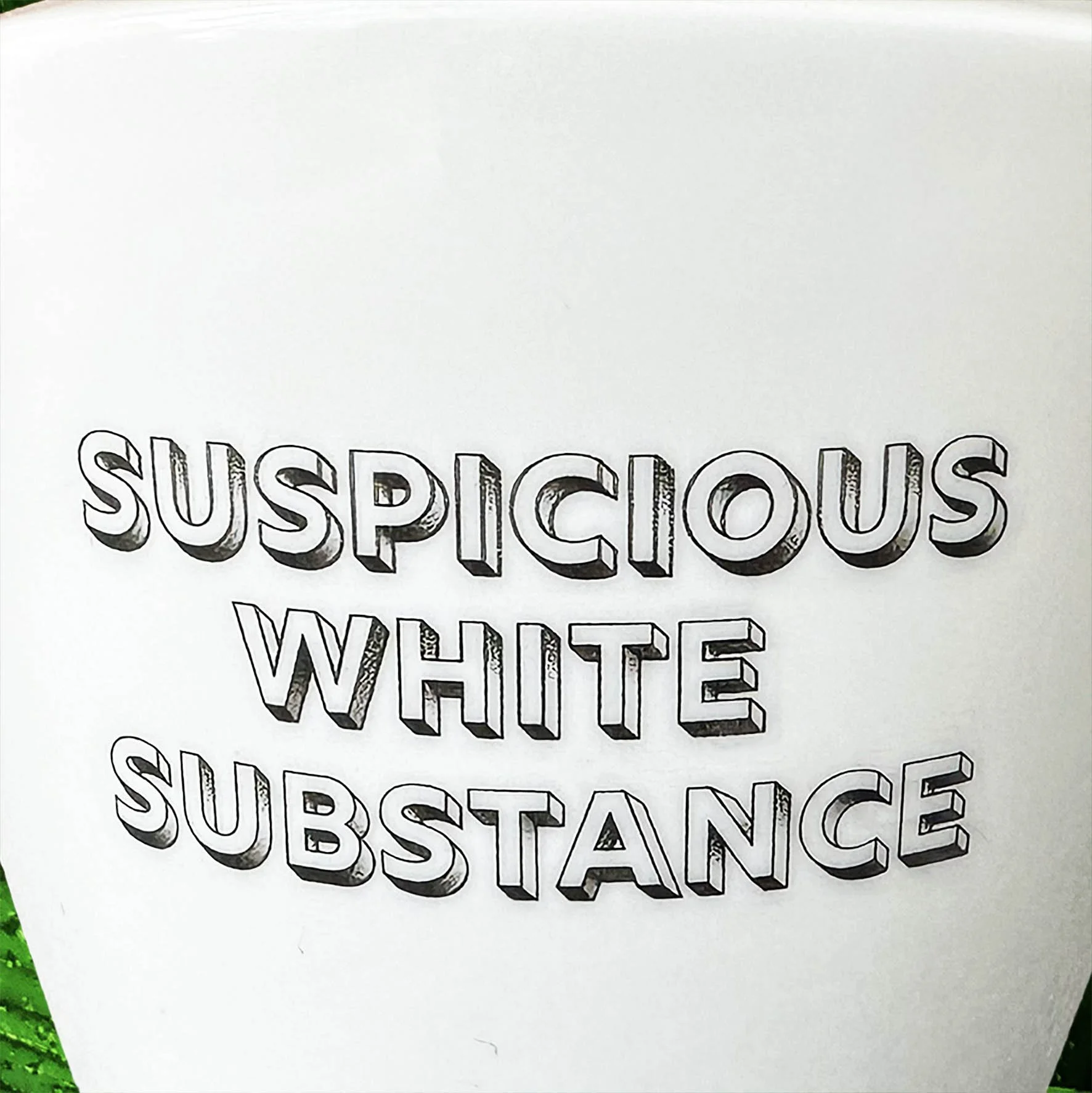 White sugar bowl with the words “suspicious white substance” in black lettering