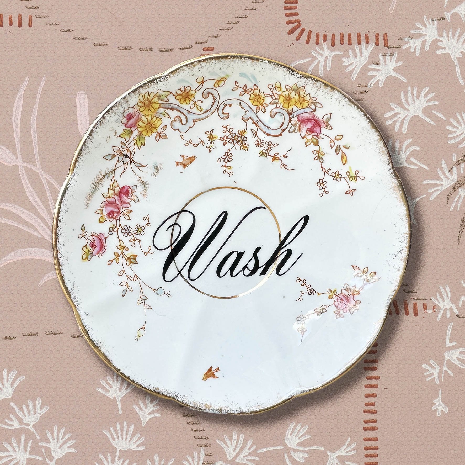Vintage saucer with the word “wash”