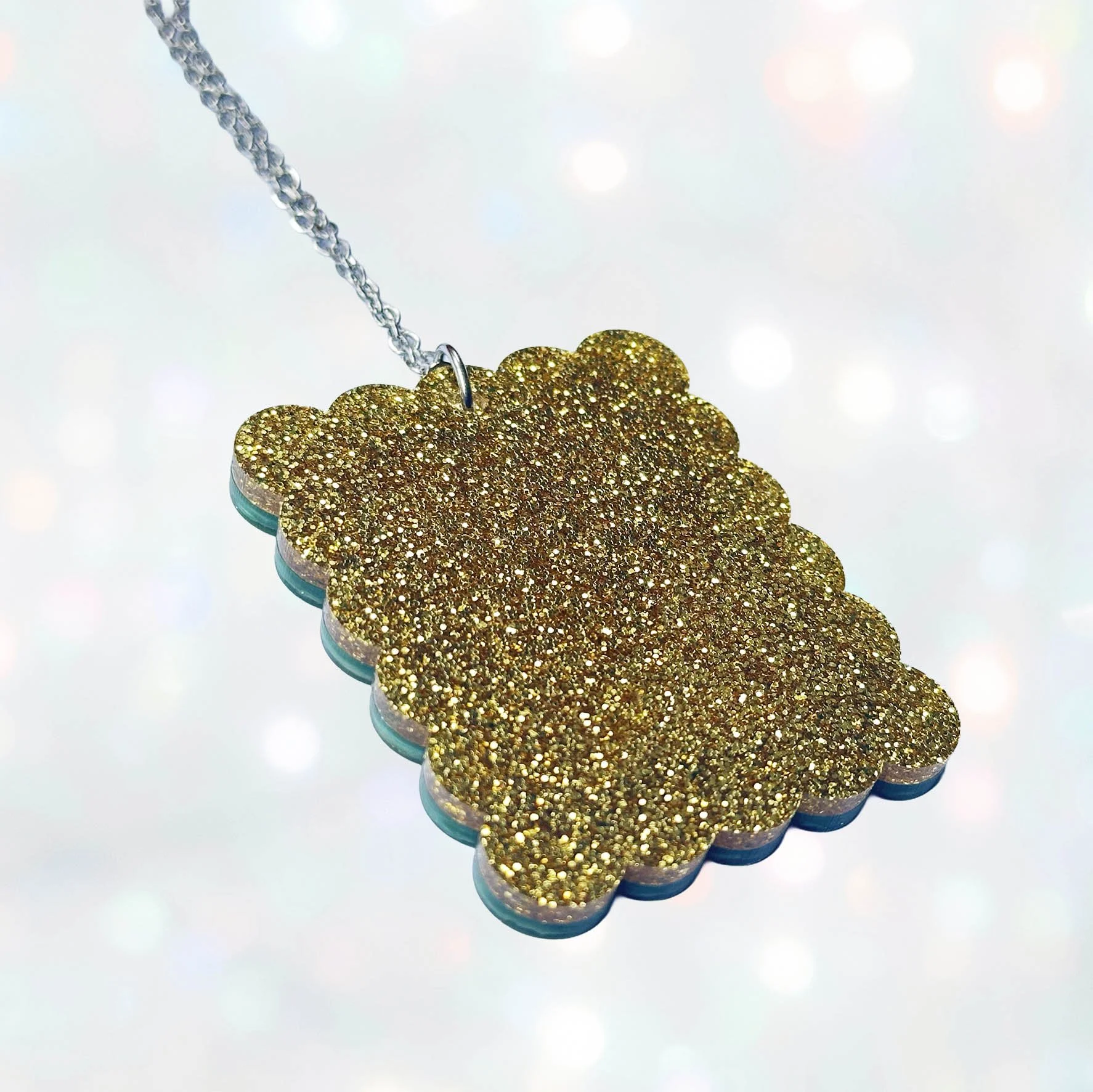 Green glitter acrylic rectangle necklace featuring a picture of Noddy