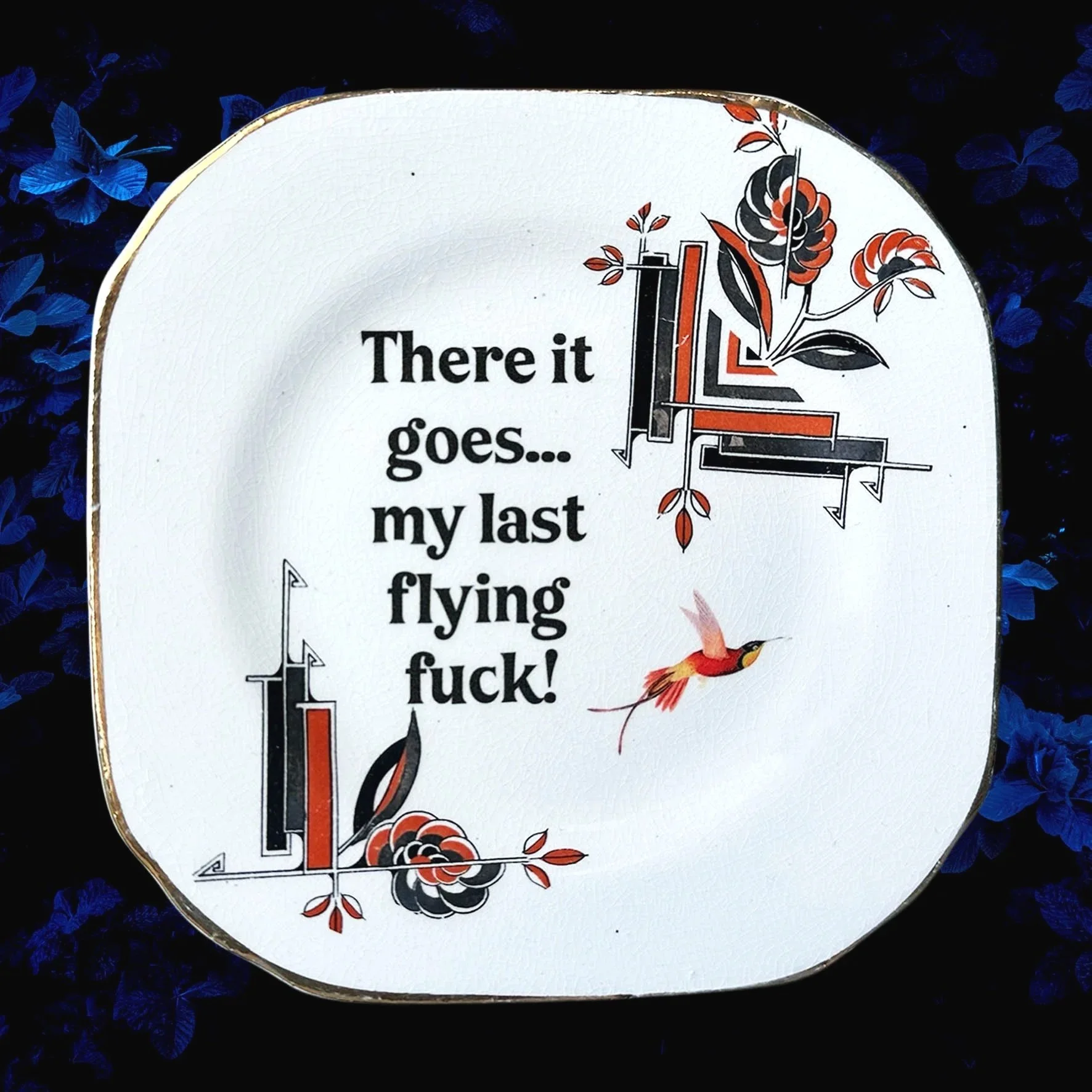 A vintage plate with a picture of a bird and the words "there it goes my last flying fuck!"