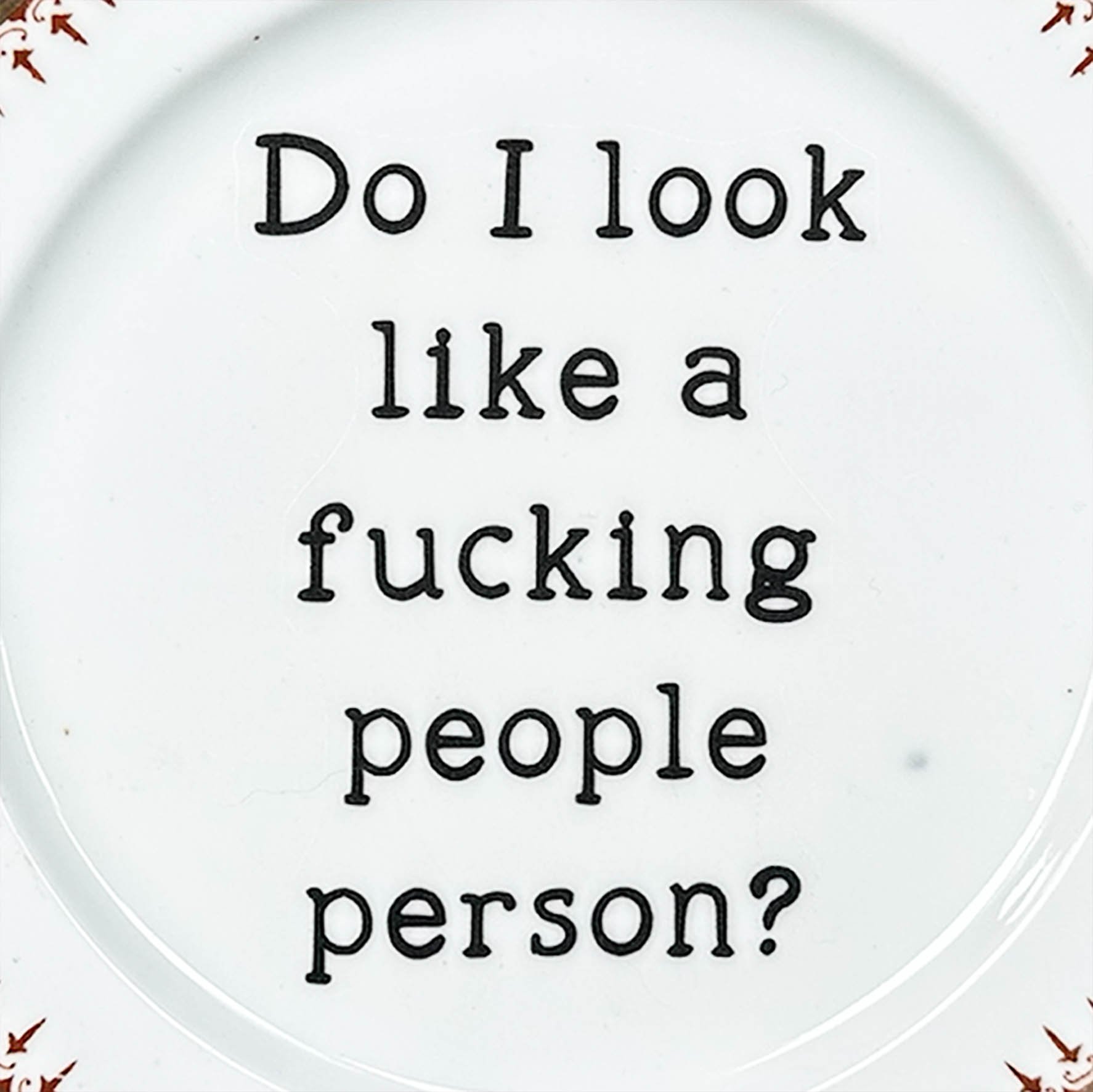 A vintage plate with the quote "do I look like a fucking people person?"