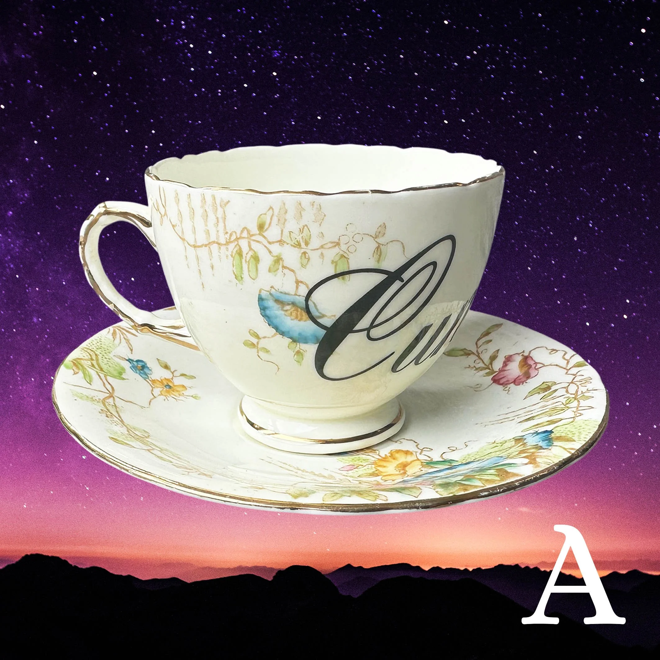 A vintage tea cup and saucer with a floral design and the word “Cunt” in black cursive writing
