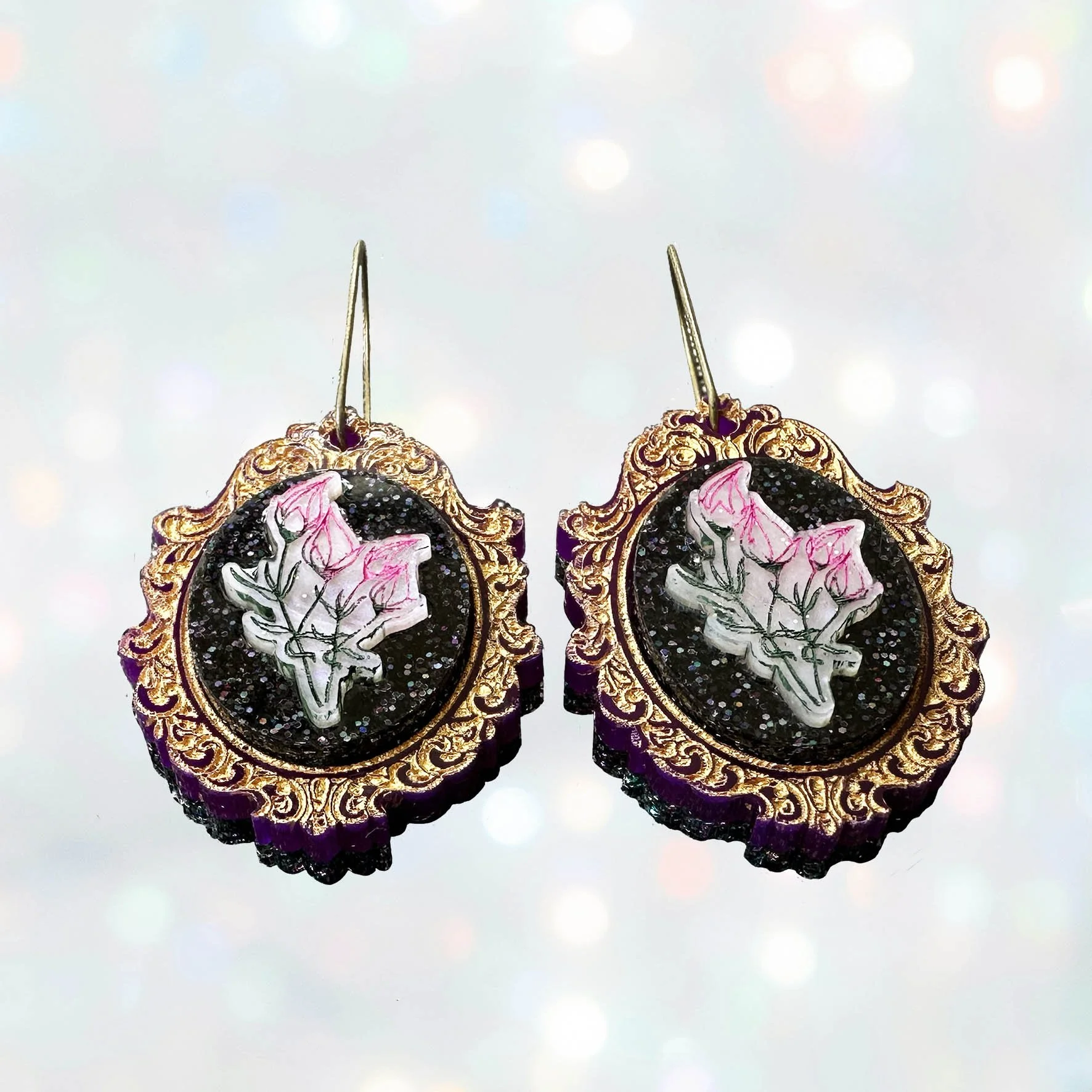 Laser cut flower earrings in cameo style frames, gold, pink and black glitter acrylic
