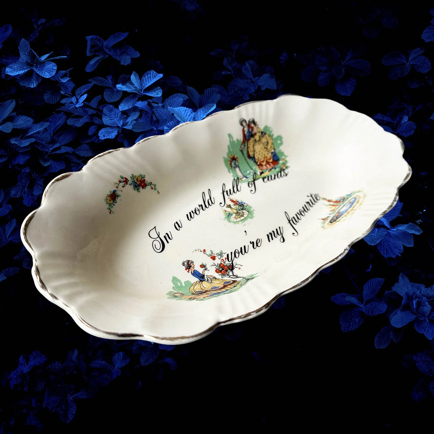 A vintage trinket dish with the quote “In a world full of cunts you’re my favourite”