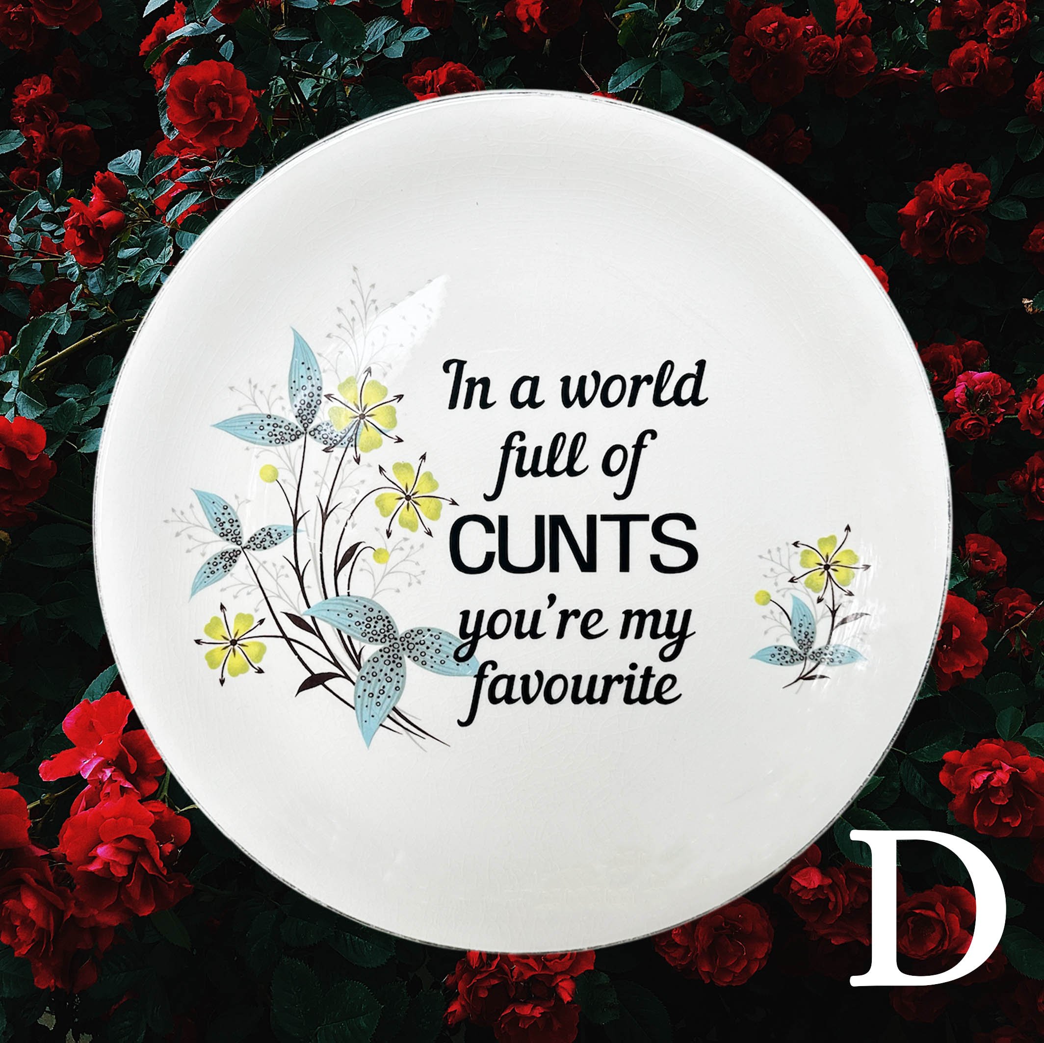 In a world full of cunts you’re my favourite, funny and explicit decorative vintage plate, as stocked by World Brand NZ, floral with black writing