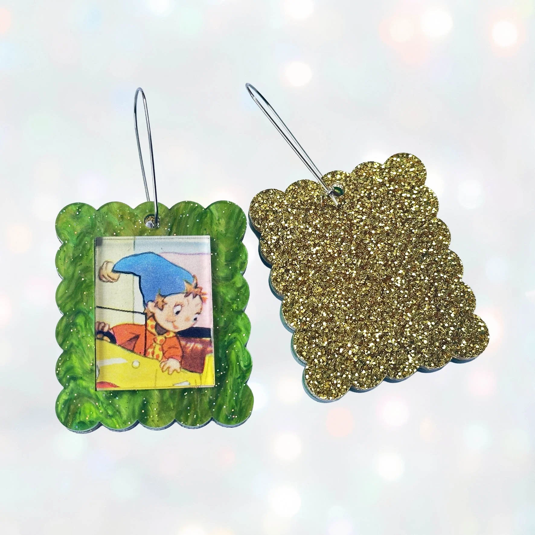 Green glitter acrylic rectangle earrings featuring a picture of Noddy