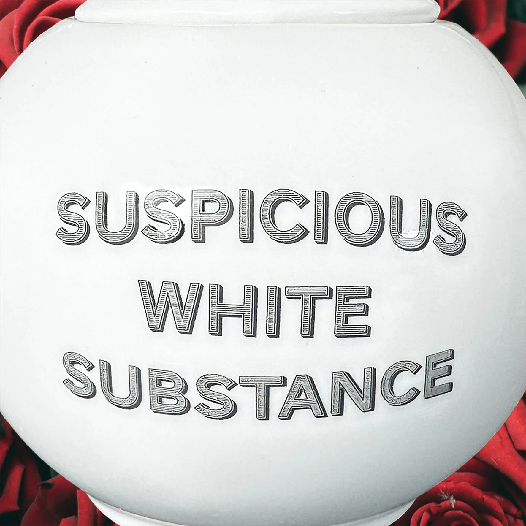 A round white sugar bowl with a quote “suspicious white substance”