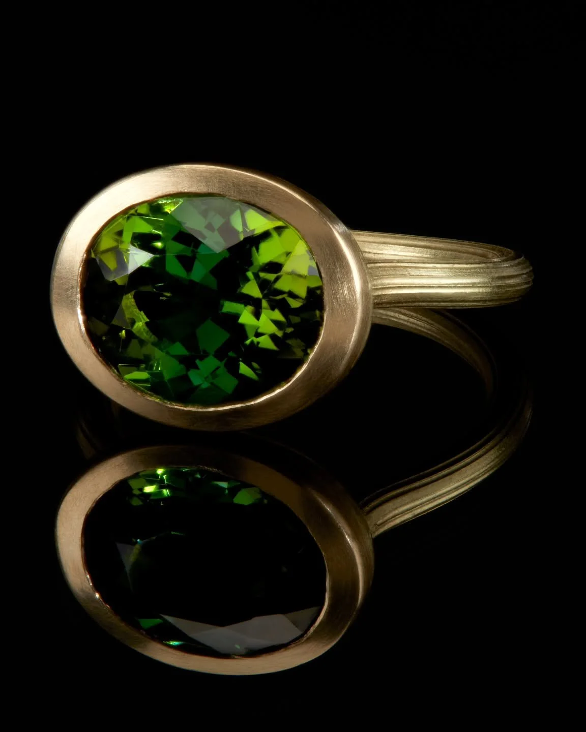 My very own treasure. Special edition in the most verdant green tourmaline, alive with many tones this stone spoke to me and became the centre piece for a celebratory ring marking a special anniversary.  Wrapped in rich yellow gold, this piece is sim