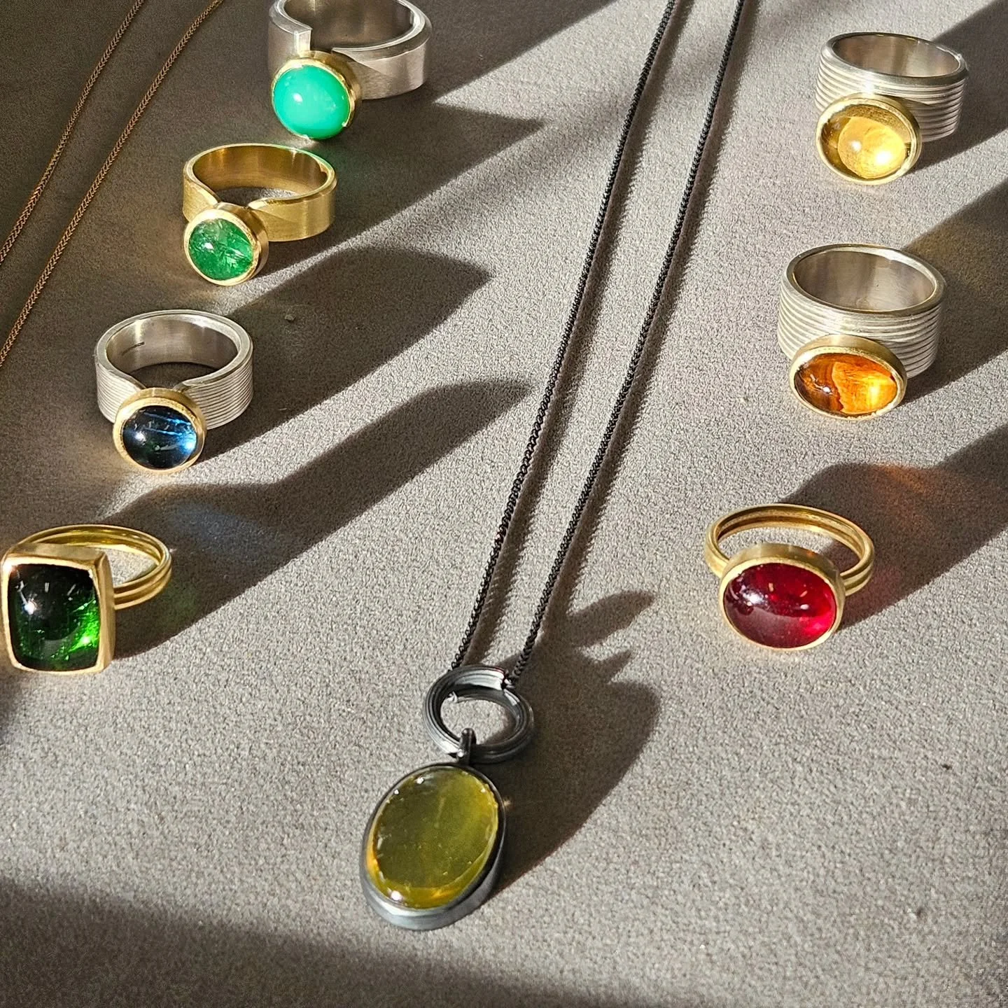 A colourful cohort on its way to @goldlarkjewel ready for their festive showcase.  A chance to try on some of this rainbow of beauties if you're local to the gallery in Saltaire, Yorkshire. 
⁠
#madebyhand #handcrafted #contemporaryjewellery #finejewe