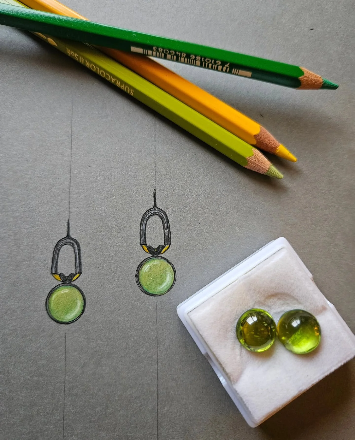 Every piece begins here.

A conversation. An idea. A sketch.

This is the early stage of a custom earring commission &mdash; where proportions are tested, stones are chosen &mdash; in this case, beautiful Afghan peridot &mdash; and the design starts 