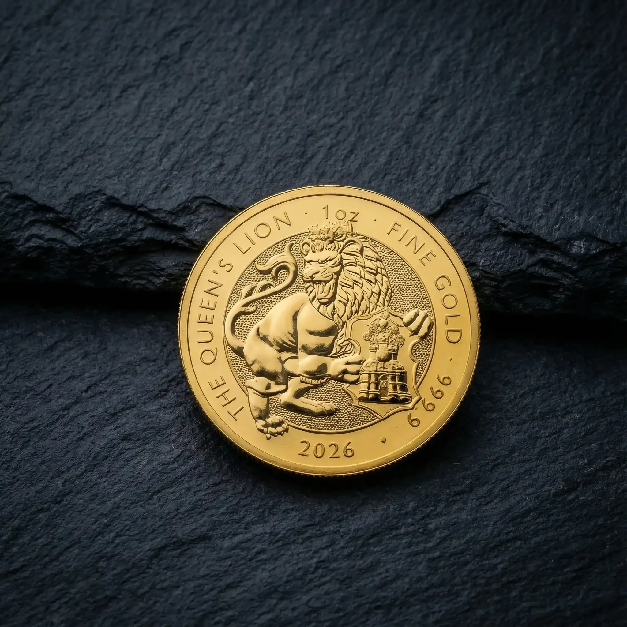 A gold coin featuring a lion and a tree, with inscriptions 'The Queen's Lion 1oz Fine Gold 9999 2026'.