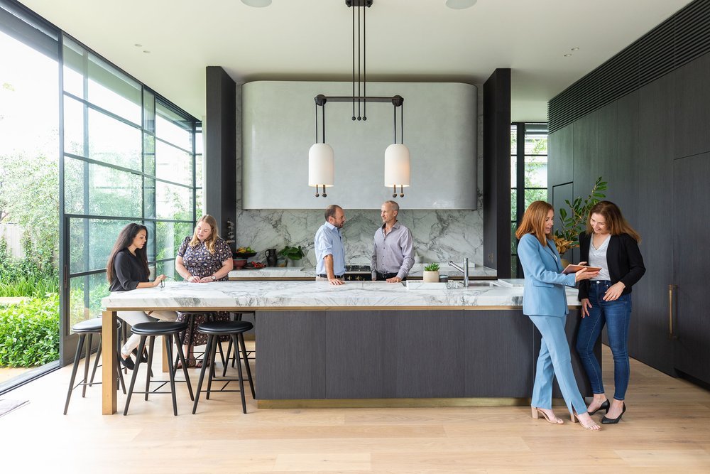 Professional building team working together in bright office space