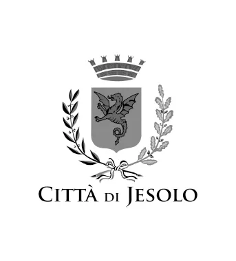 Stemma della città di Jesolo con un drago al centro, corone e rami decorativi, e scritto "Città di Jesolo".