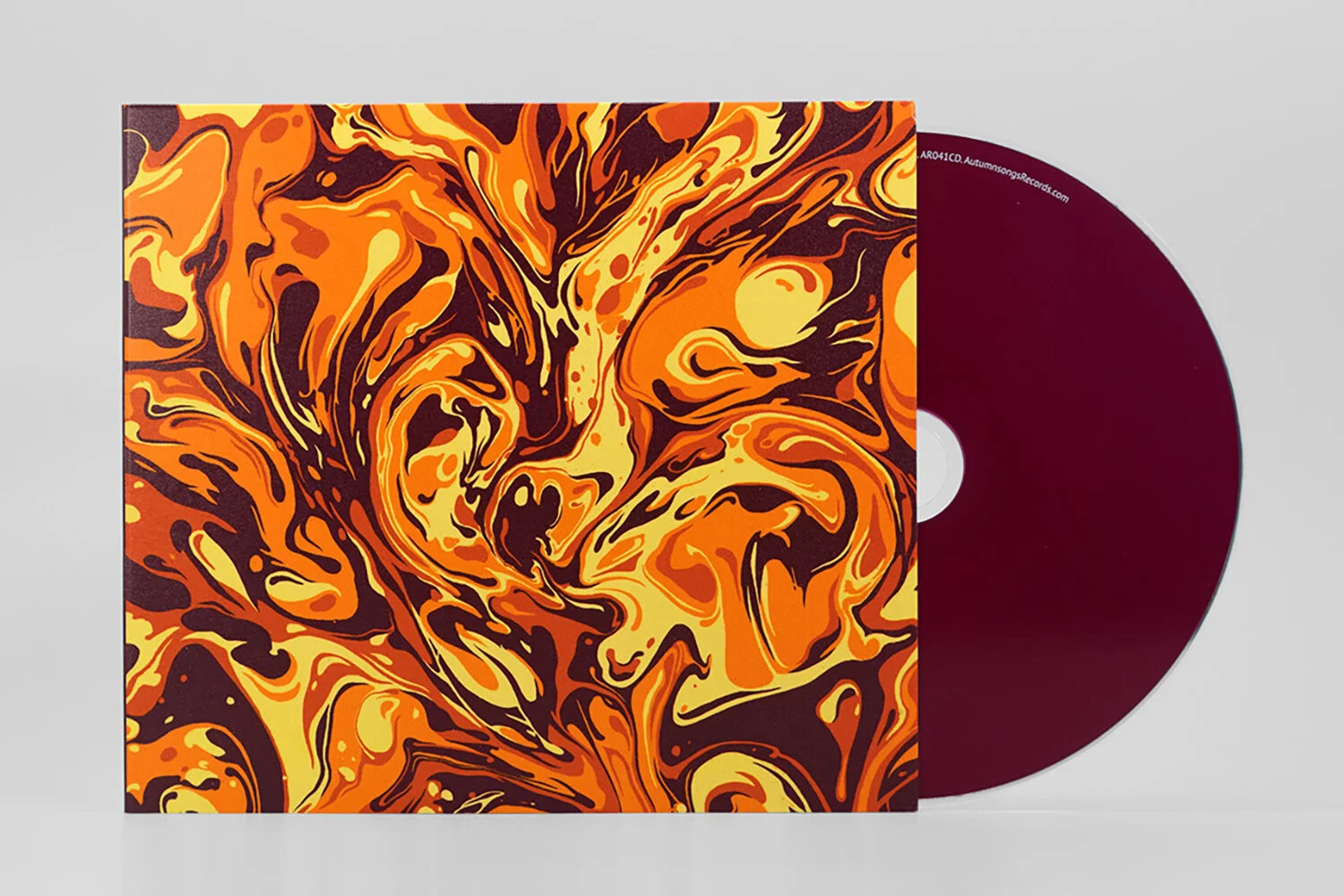 Vinyl record sleeve with an abstract swirling pattern in orange, yellow, and dark brown, partially showing a maroon-colored record.