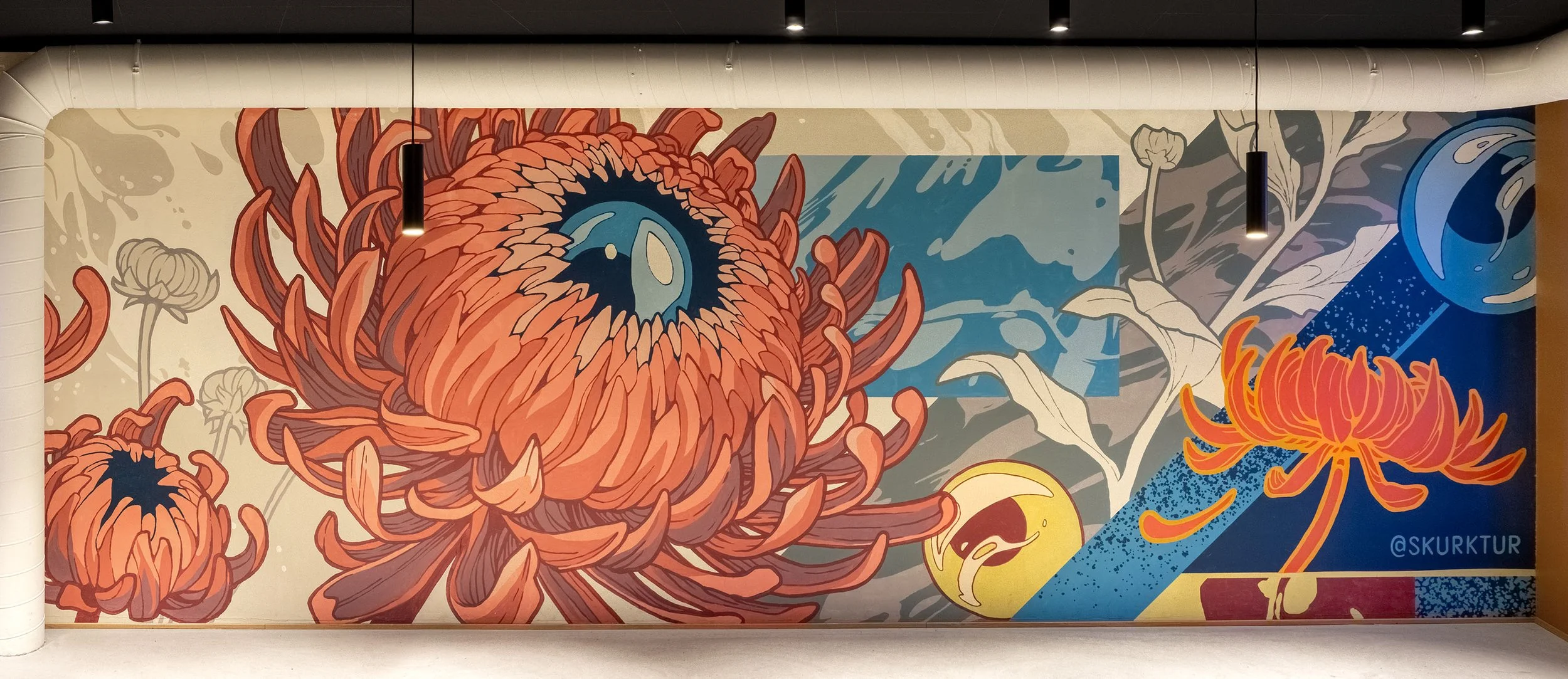 Colorful mural of large orange chrysanthemum flowers with a big eye in the center of one flower, surrounded by abstract shapes and floral patterns.