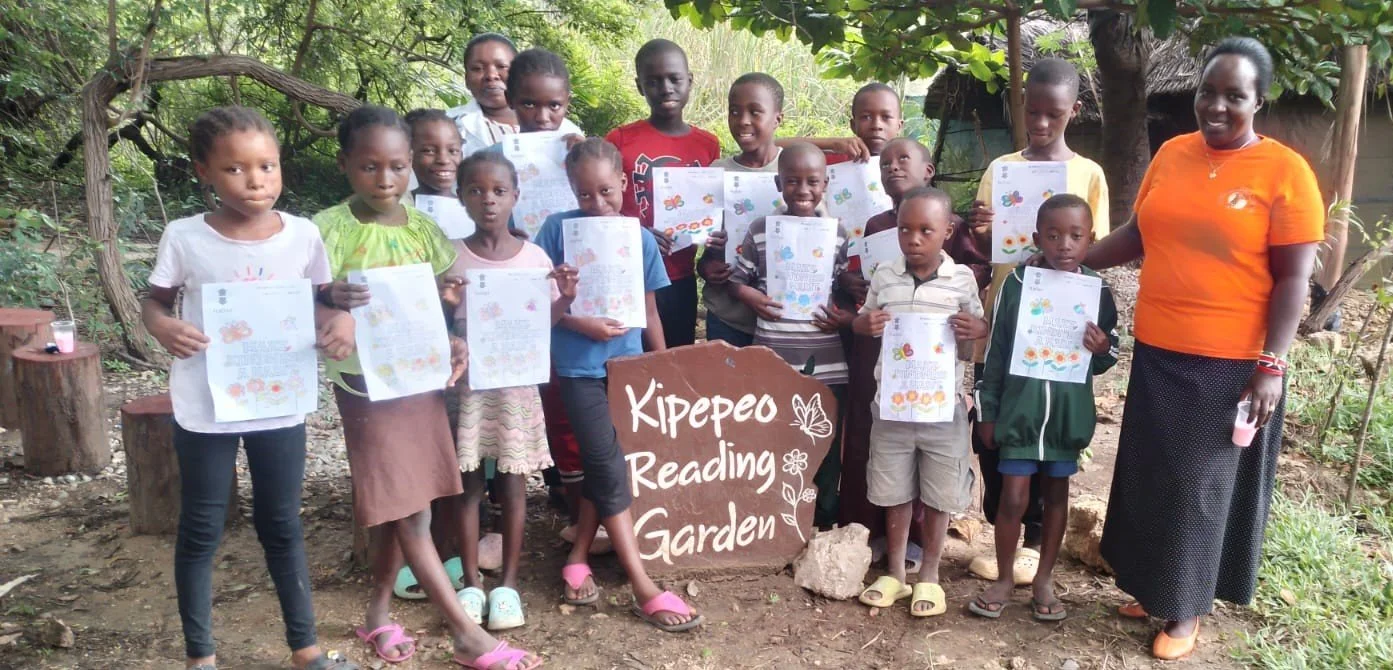 Children display their activity sheet on 'kindness'