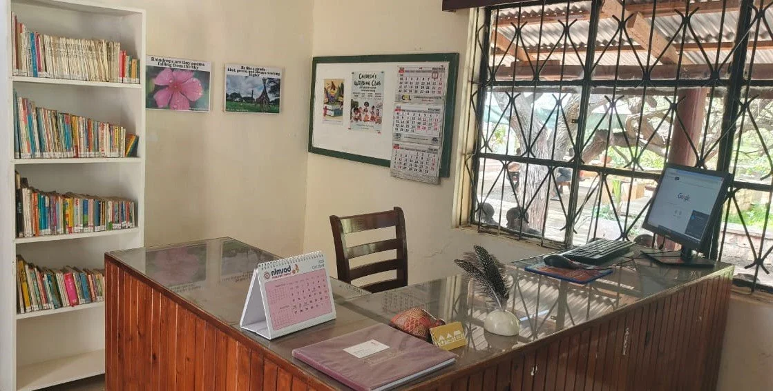 Library reception-desk.  Toddler book shelf in display