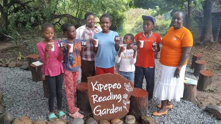 Children at Kipepeo Reading Garden enjoy refreshments
