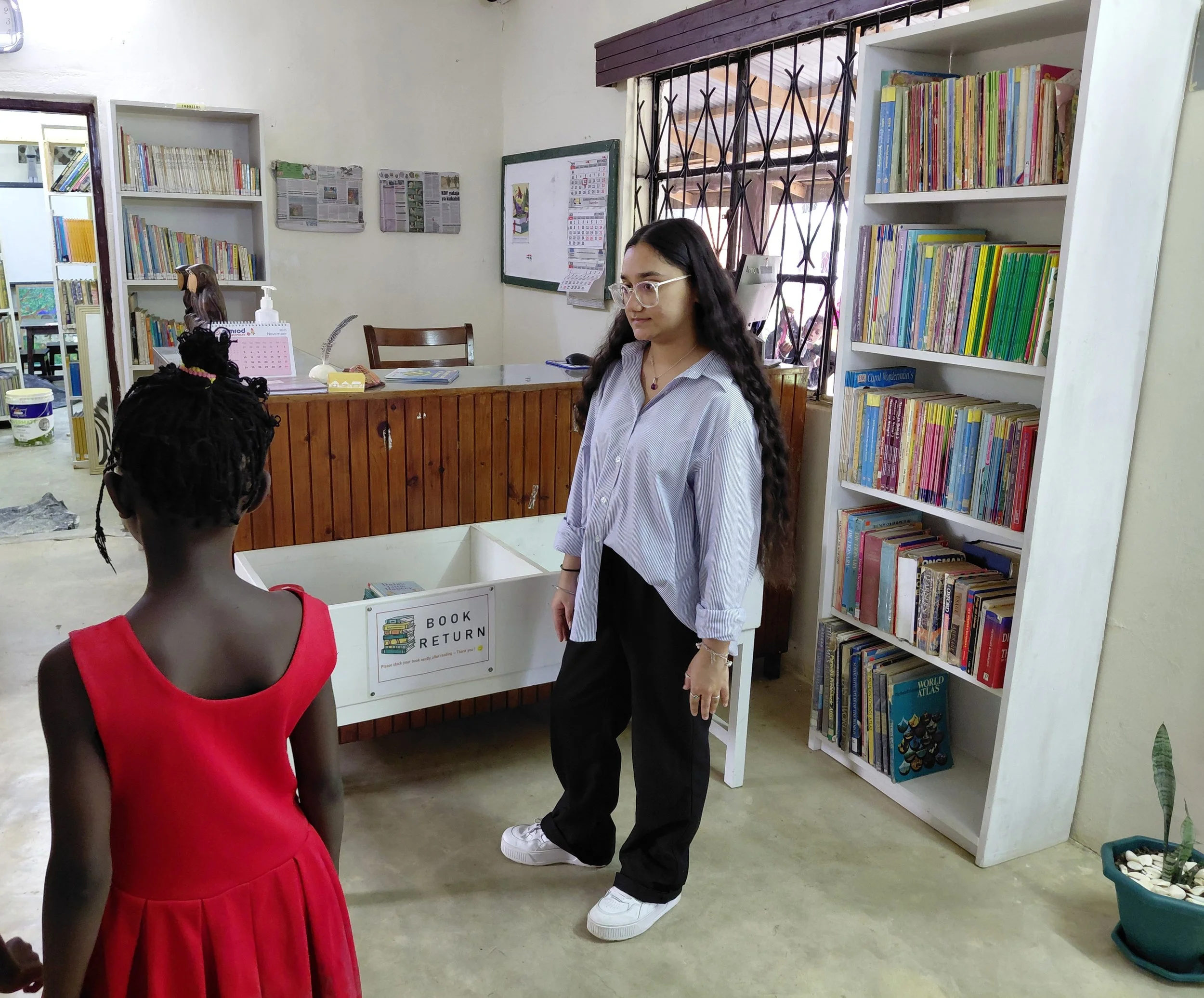 Kids taken through library etiquette training