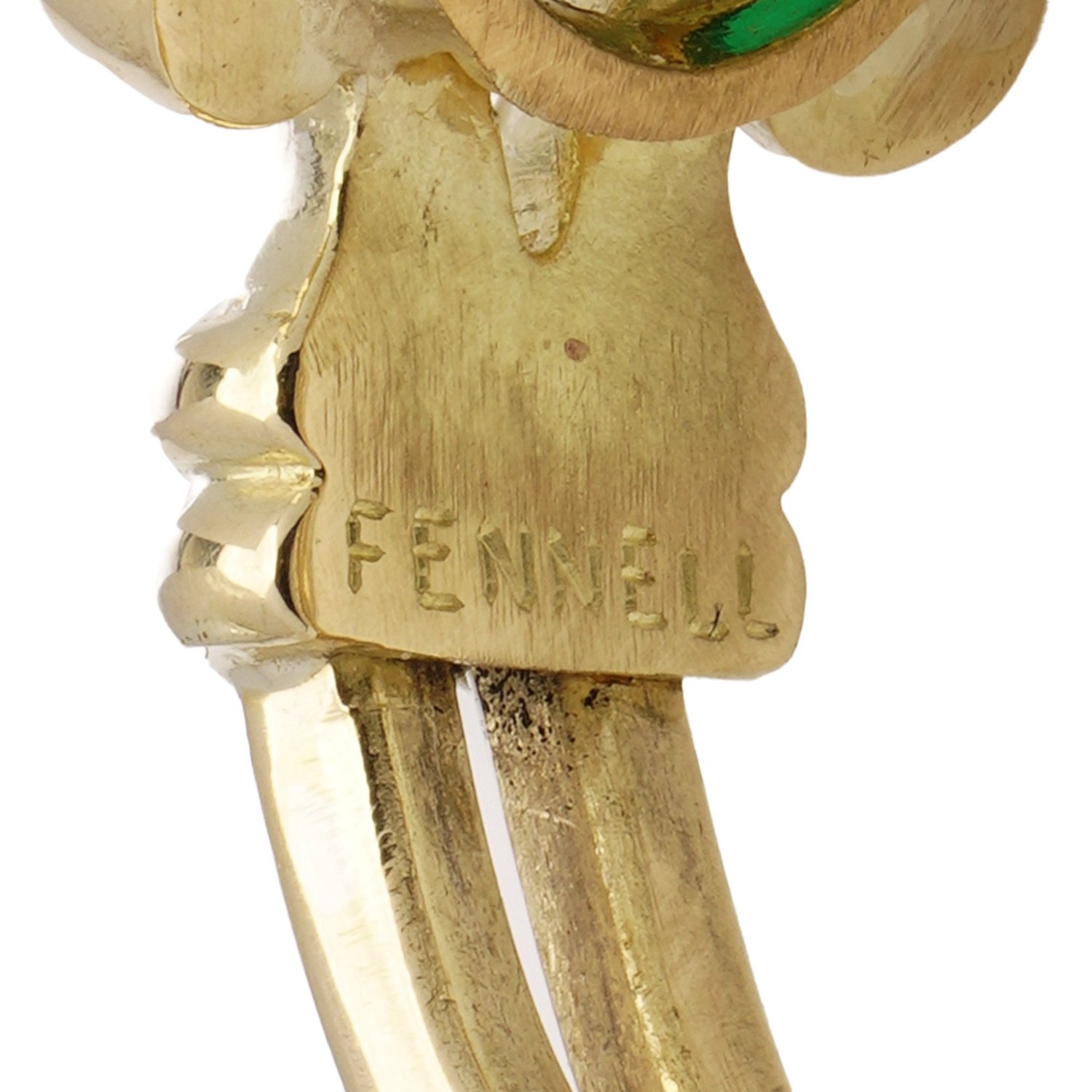 Close-up of the FENNELL maker's mark stamped into the 18KT gold shank of a Theo Fennell ring
